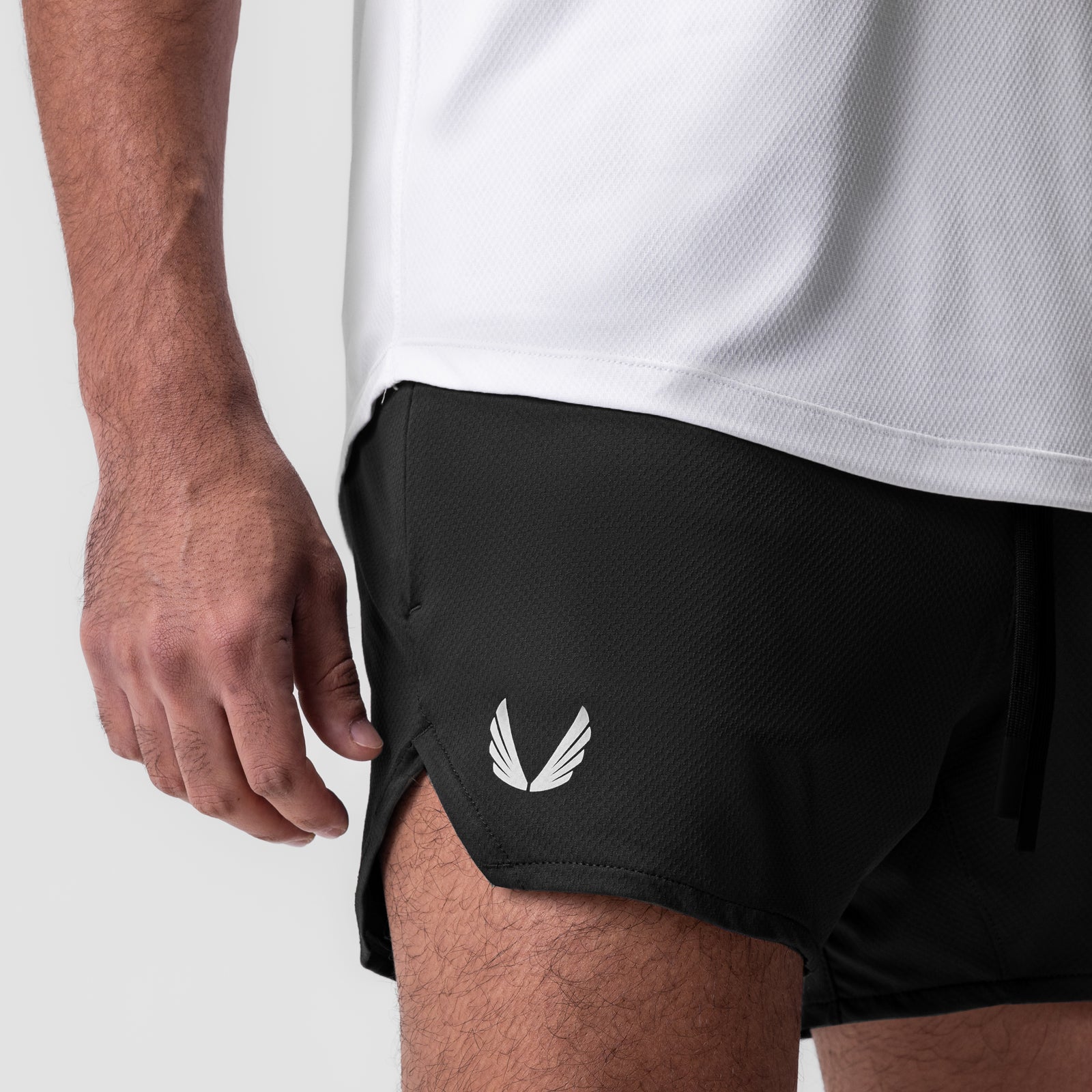 AeroSilver 5" Linerless Short in black, worn by model, side view