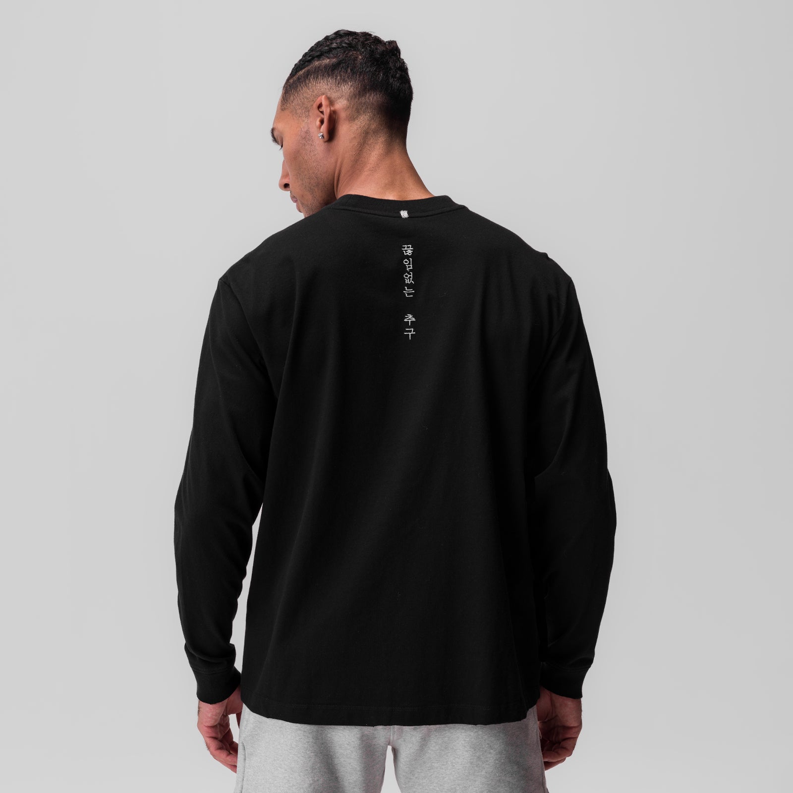 Tech Essential Relaxed Long Sleeve in black, back view on model