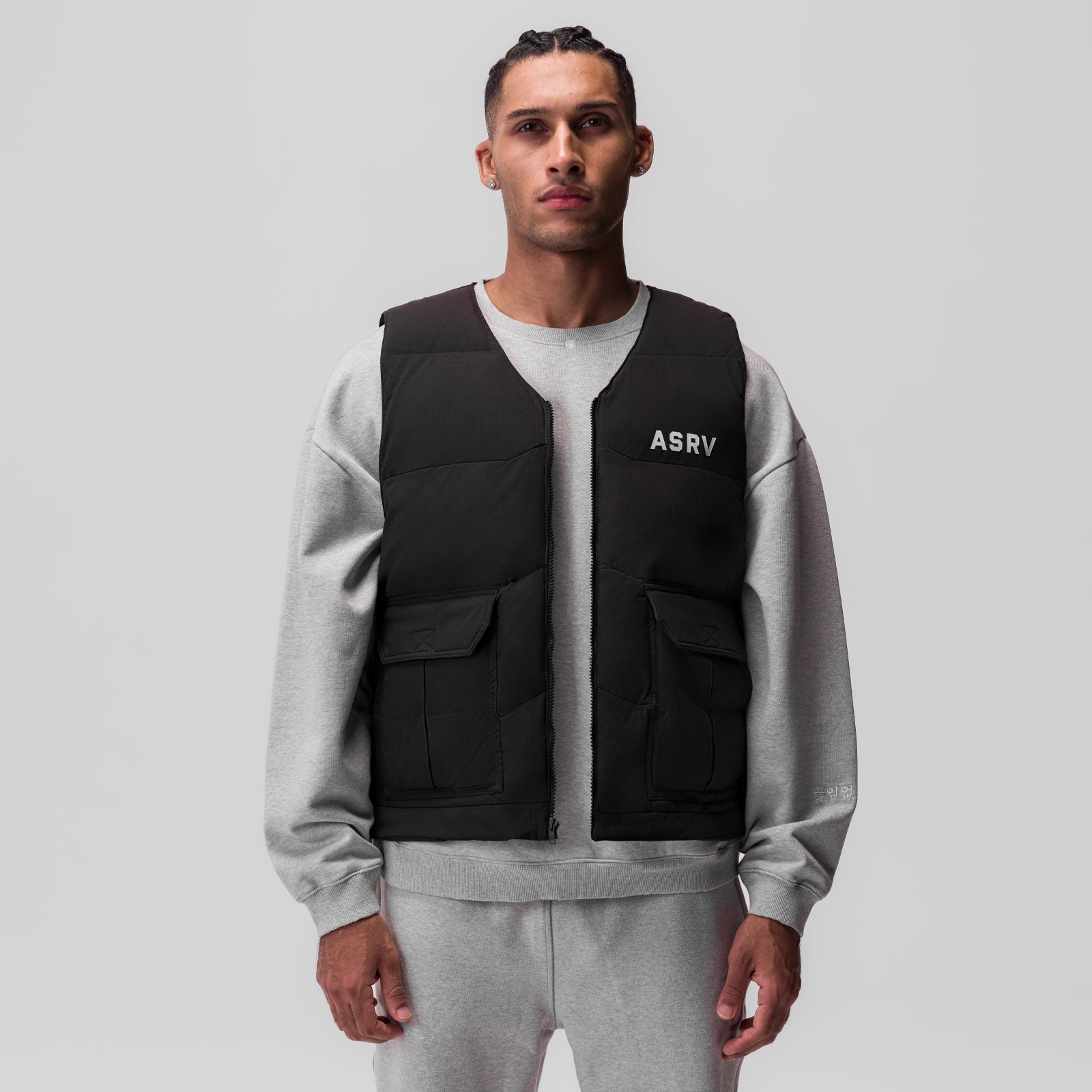 Ripstop Insulated Puffer Gilet in black worn over grey sweatshirt, front view