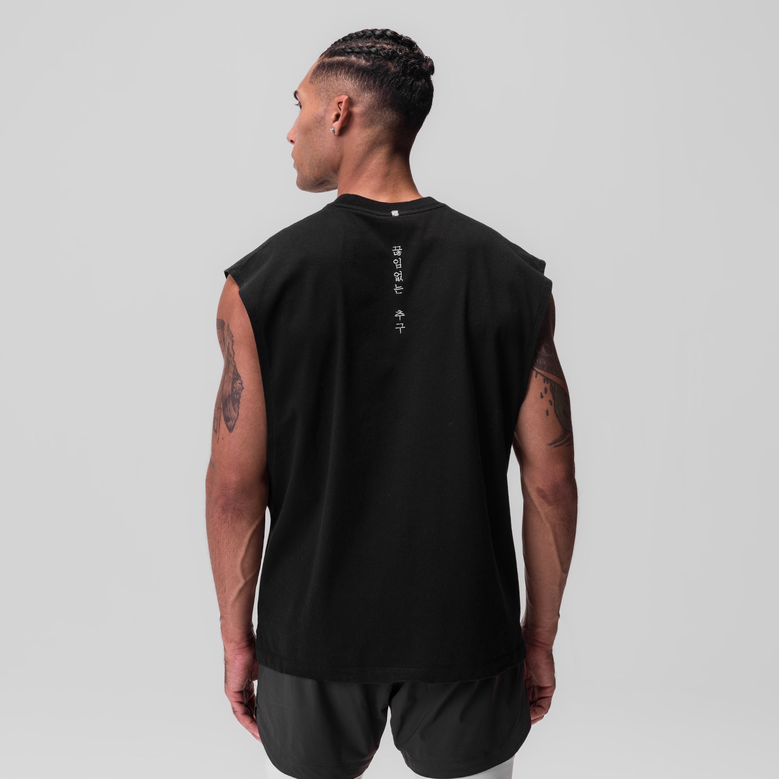 Tech Essential Rocker Cutoff in black, rear view on model