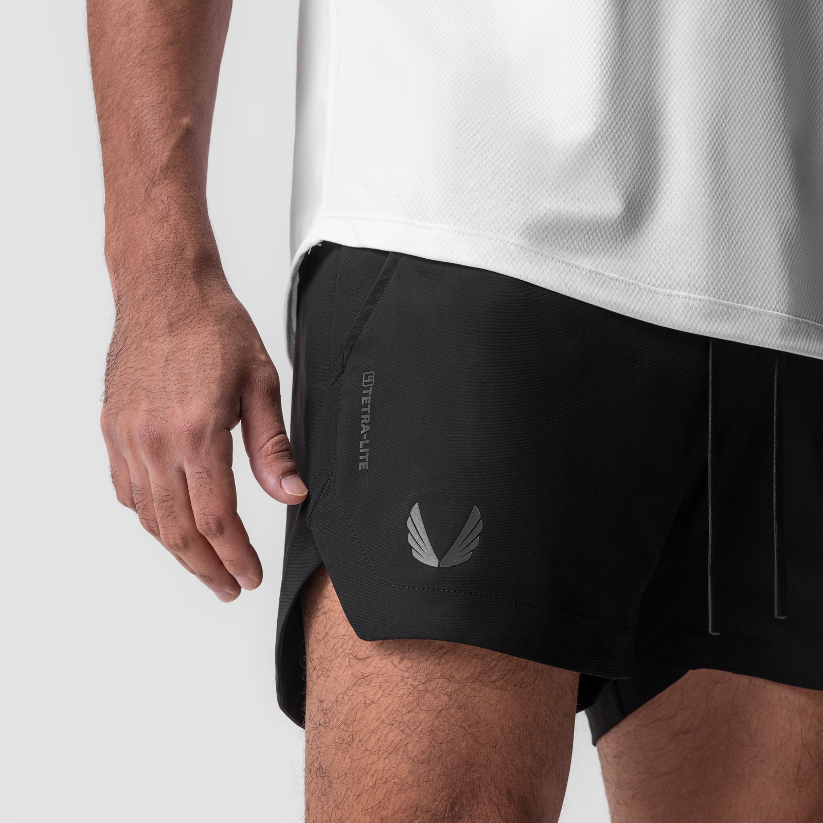 Tetra-Lite 5" Linerless Short in black, worn by model, side view