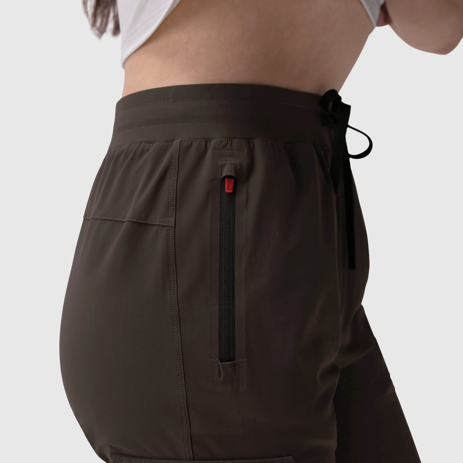 Tetra-Lite Cargo High Rib Jogger in Dark Earth, side view on model
