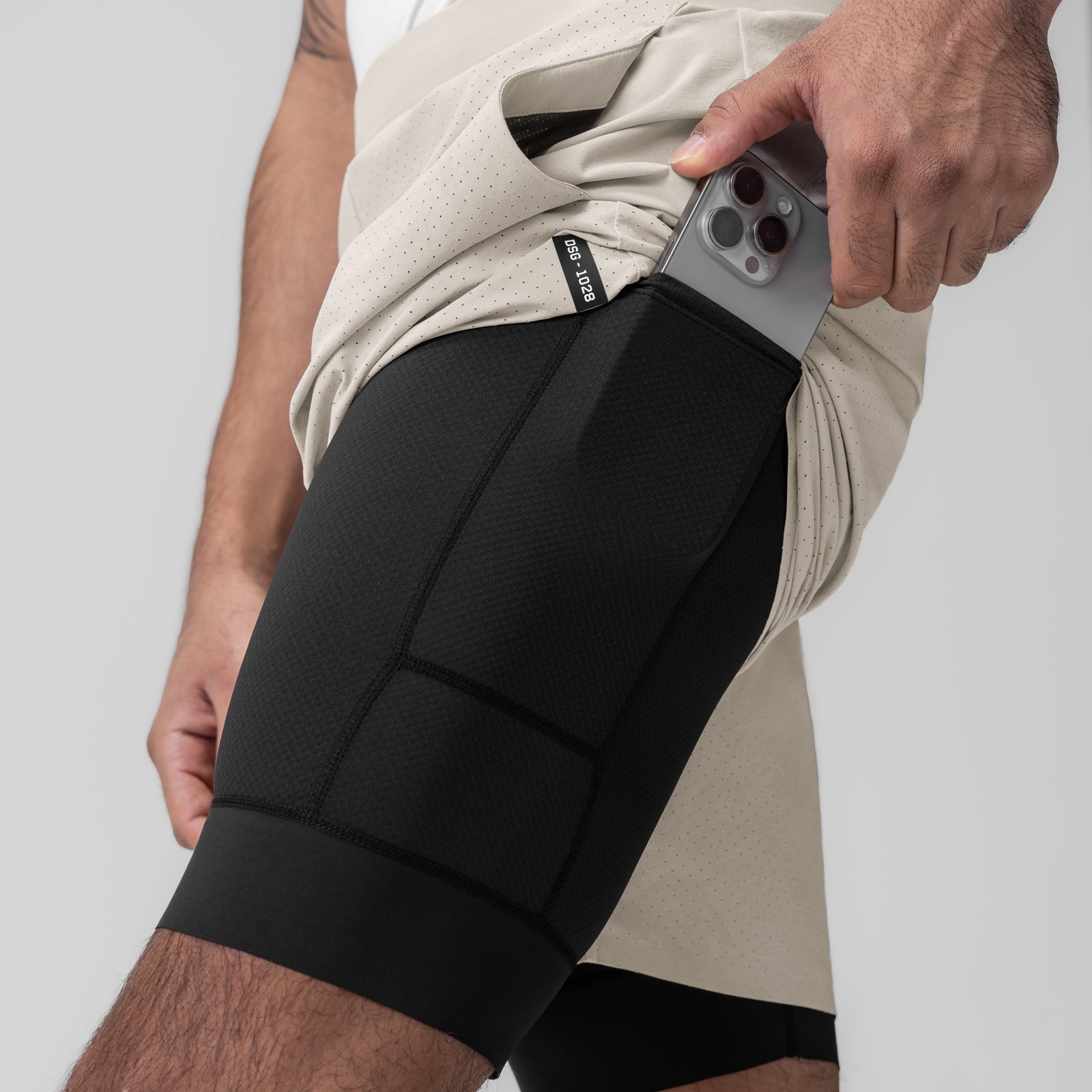 Aerotex Bonded 7" Liner Short in Chai, worn by model holding phone in pocket