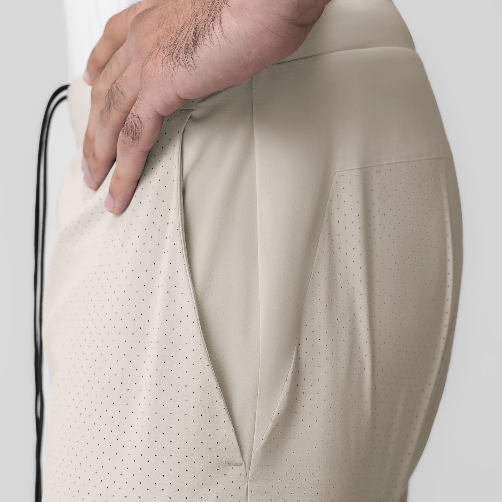 Aerotex Bonded 7" Liner Short in Chai, model wearing showing side pocket detail