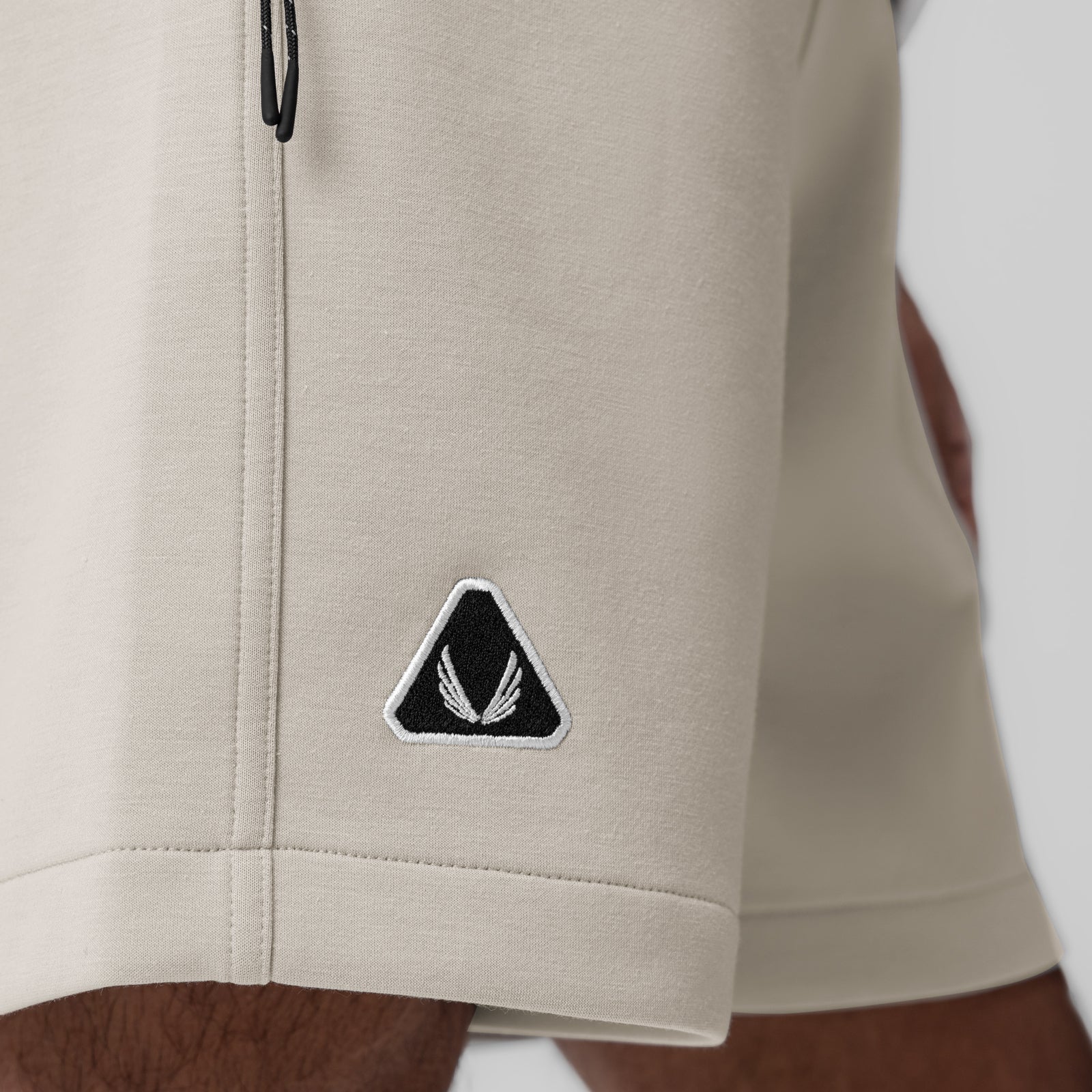Dri-Core™ Training Short in Chai worn by model, side detail showing ASRV logo