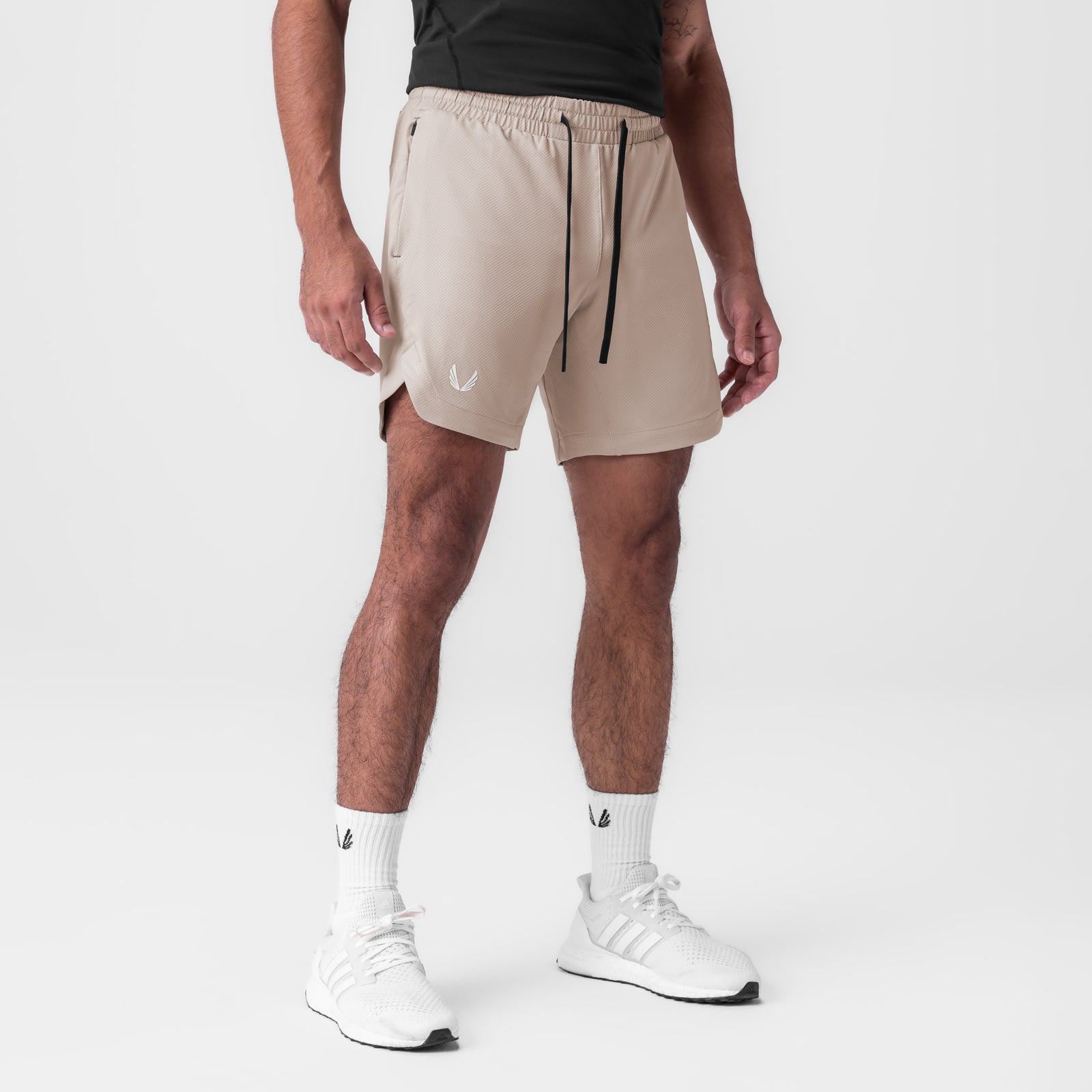 AeroSilver 7" linerless shorts in chai, worn with white socks and sneakers, front view