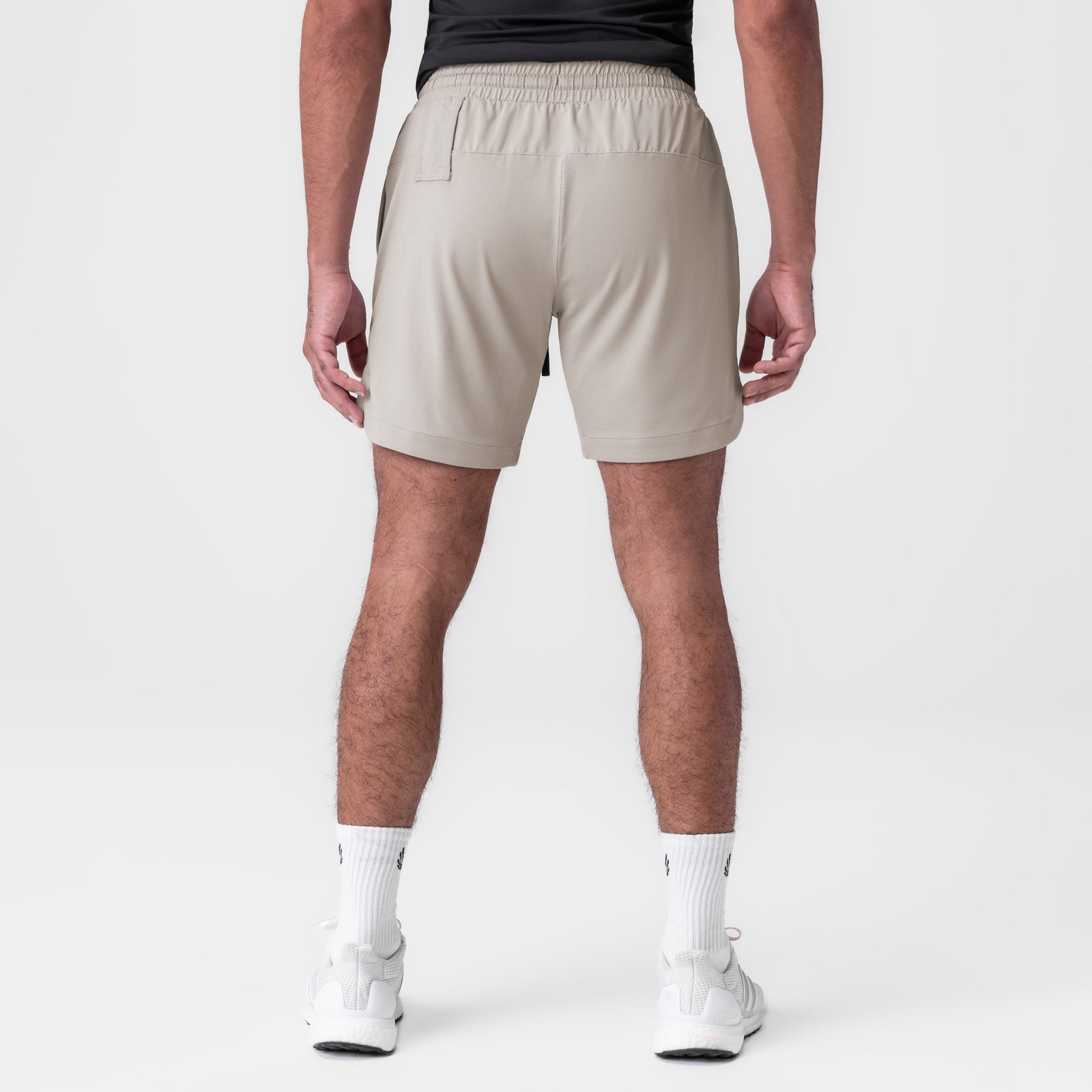 AeroSilver 7" Linerless Short in Chai, back view on model