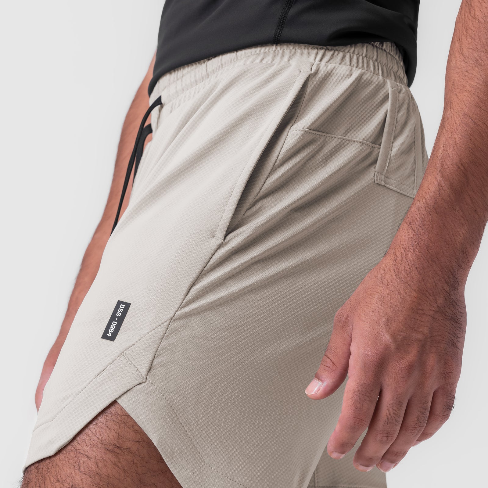 AeroSilver 7" Linerless Short in Chai, worn by model, side view