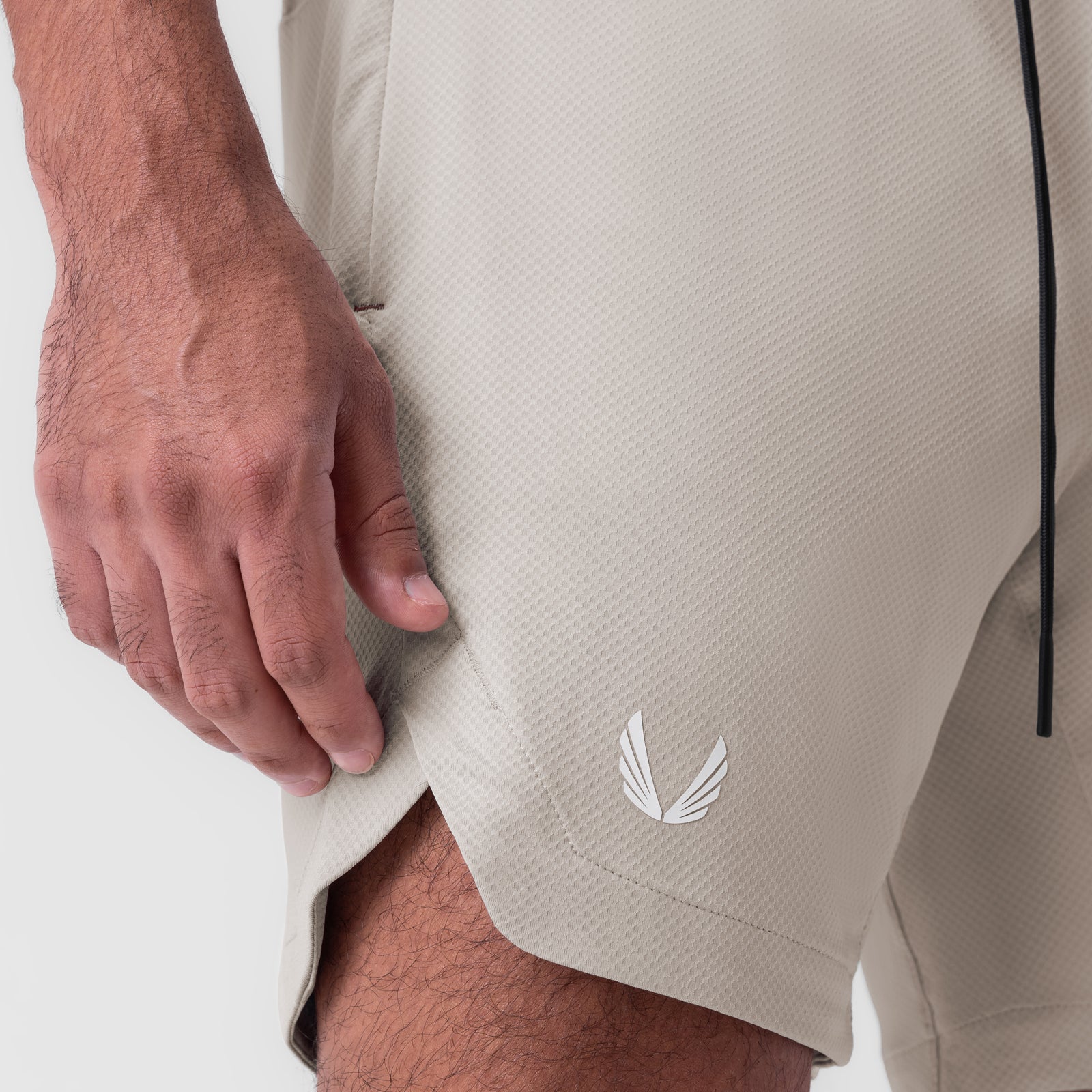 AeroSilver 7" linerless shorts in chai, worn by model showing side view and fit