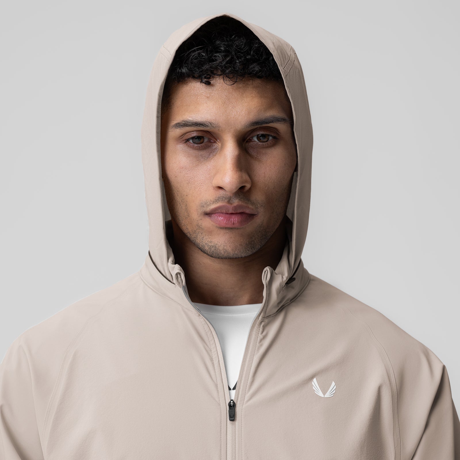 Aerotex Weather-Ready Bonded Windbreaker in Chai, worn with hood up on model