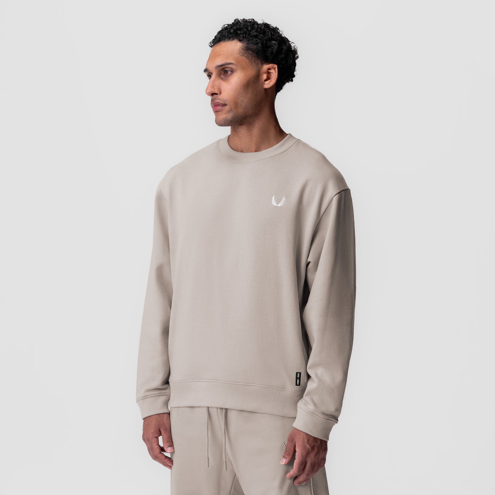 Herringbone Terry Crewneck in Chai worn by model, front profile view