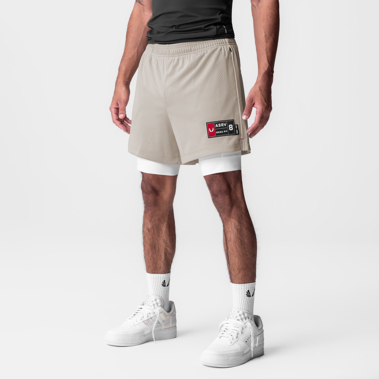 Ion-Mesh 5" Liner Short in Chai worn by model with white sneakers and socks, front view