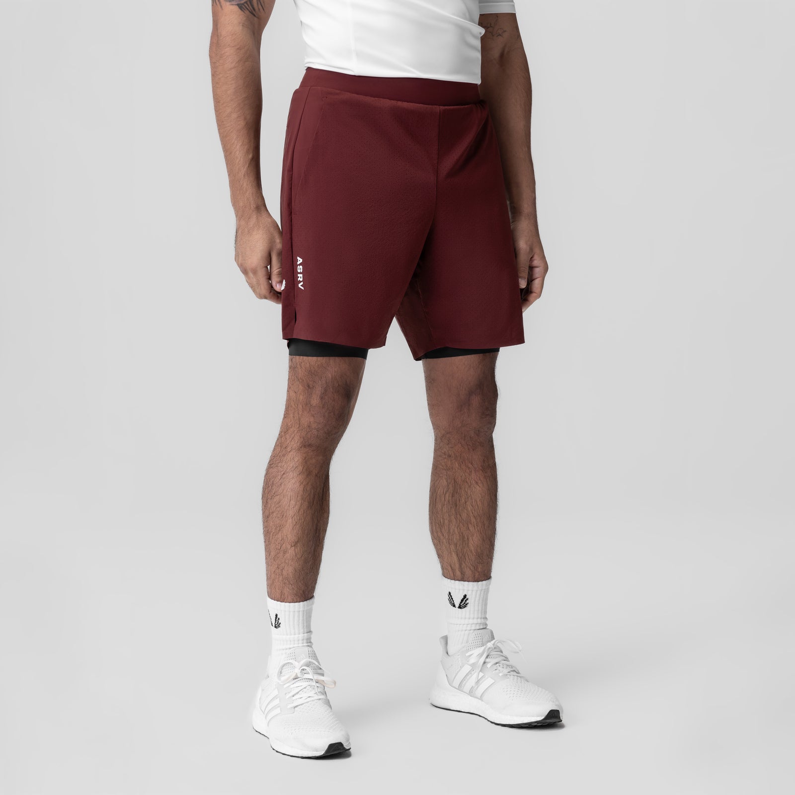 Aerotex Bonded 7" Liner Short in crimson, modeled with white sneakers and socks