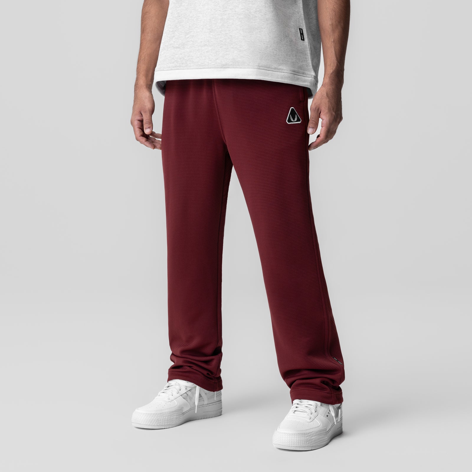 Deltapeak® Straight Leg Sweats in Crimson worn by model with white sneakers, front view