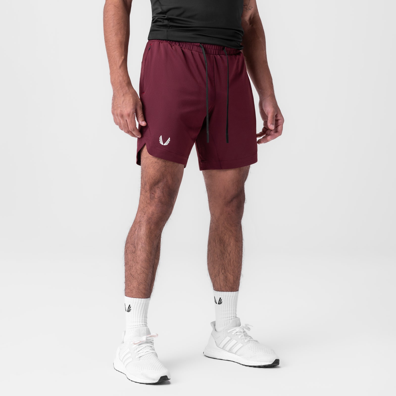 AeroSilver 7" Linerless Short in crimson, worn with white socks and sneakers