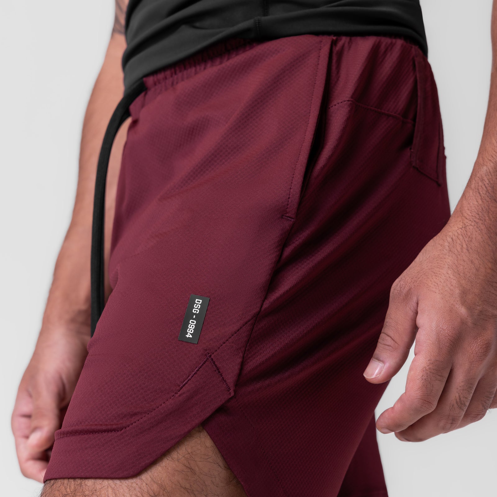 AeroSilver 7" Linerless Short in crimson, worn by model showing side detail