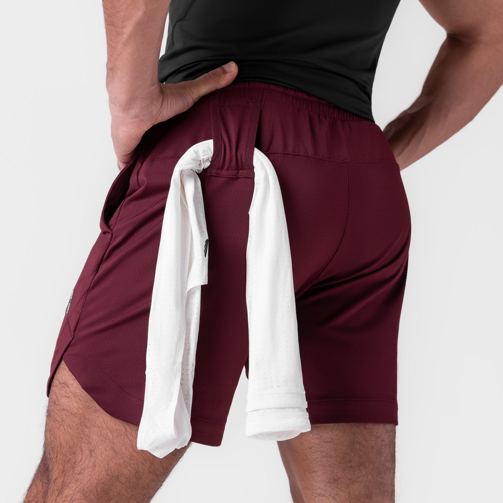 AeroSilver 7" Linerless Short in Crimson, worn by model with towel detail
