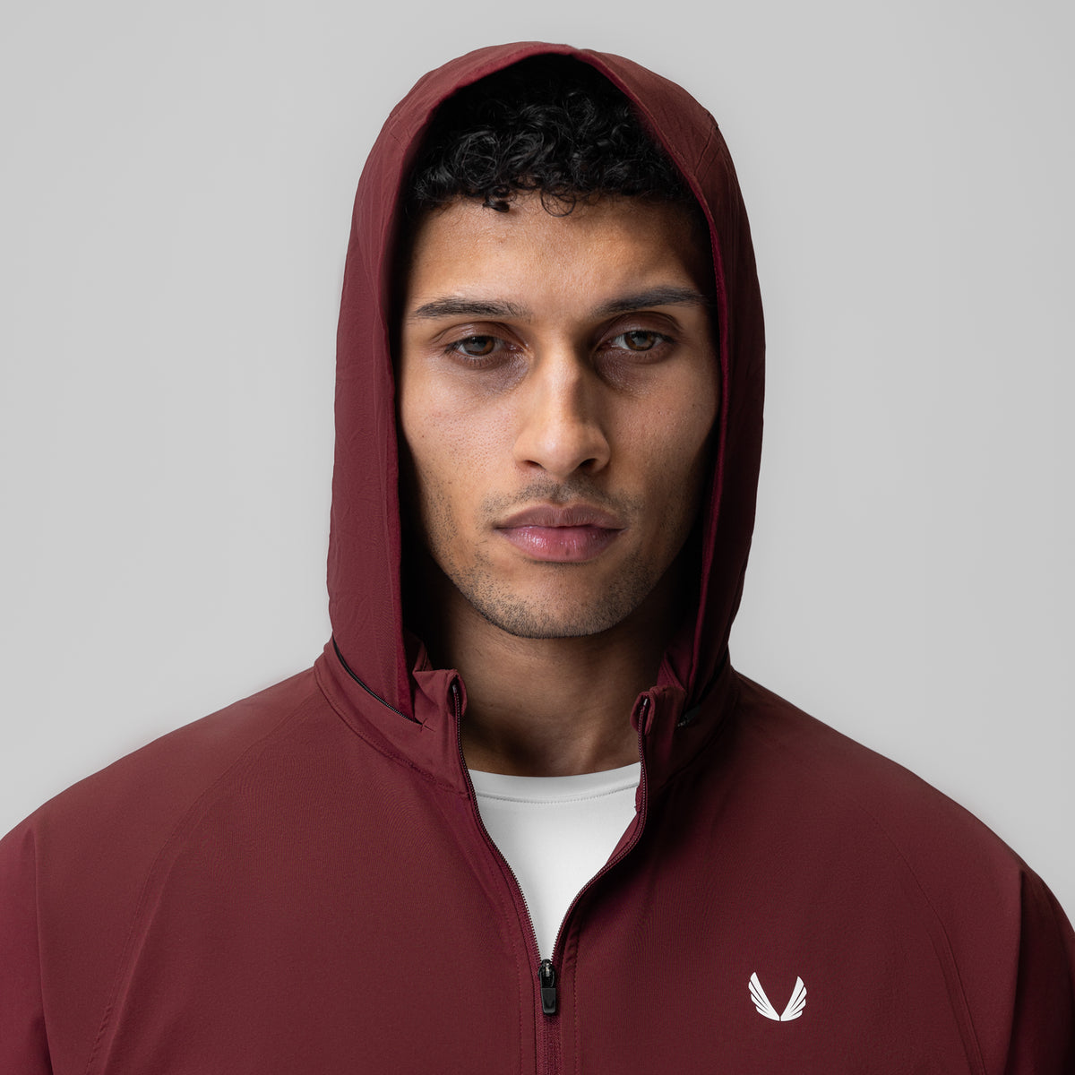 Aerotex Weather-Ready Bonded Windbreaker in crimson, worn with hood up