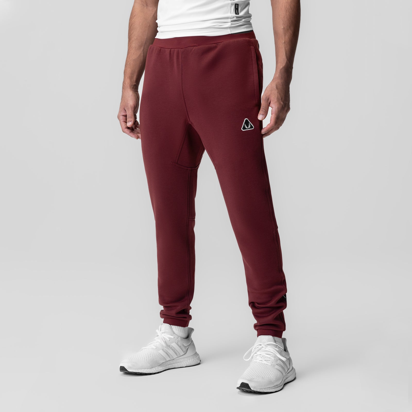 Crimson Dri-Core Training Jogger worn by model, front view with white sneakers