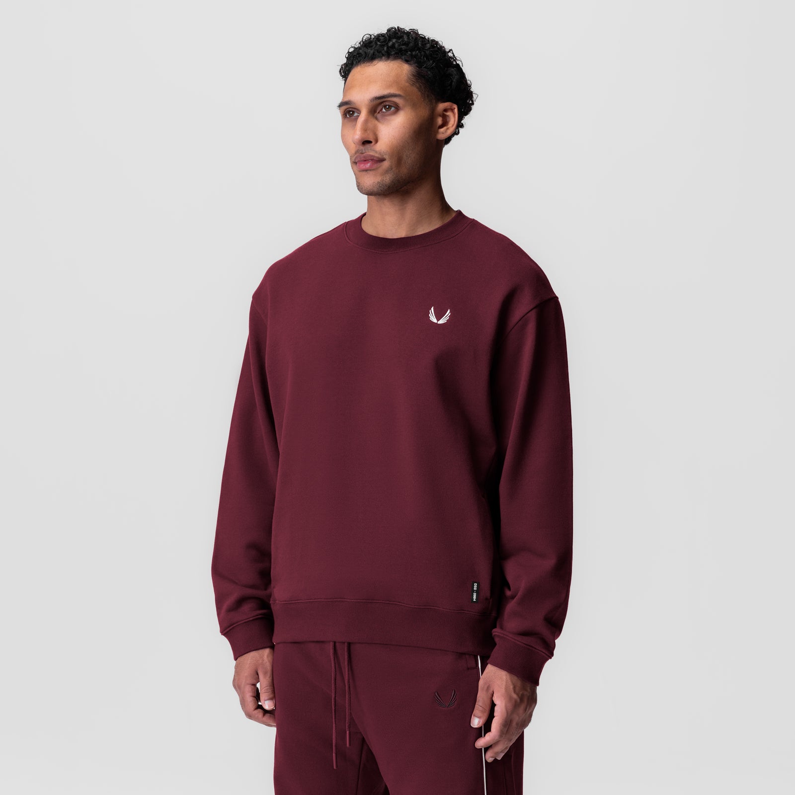 Herringbone Terry Crewneck in crimson worn by model, front view