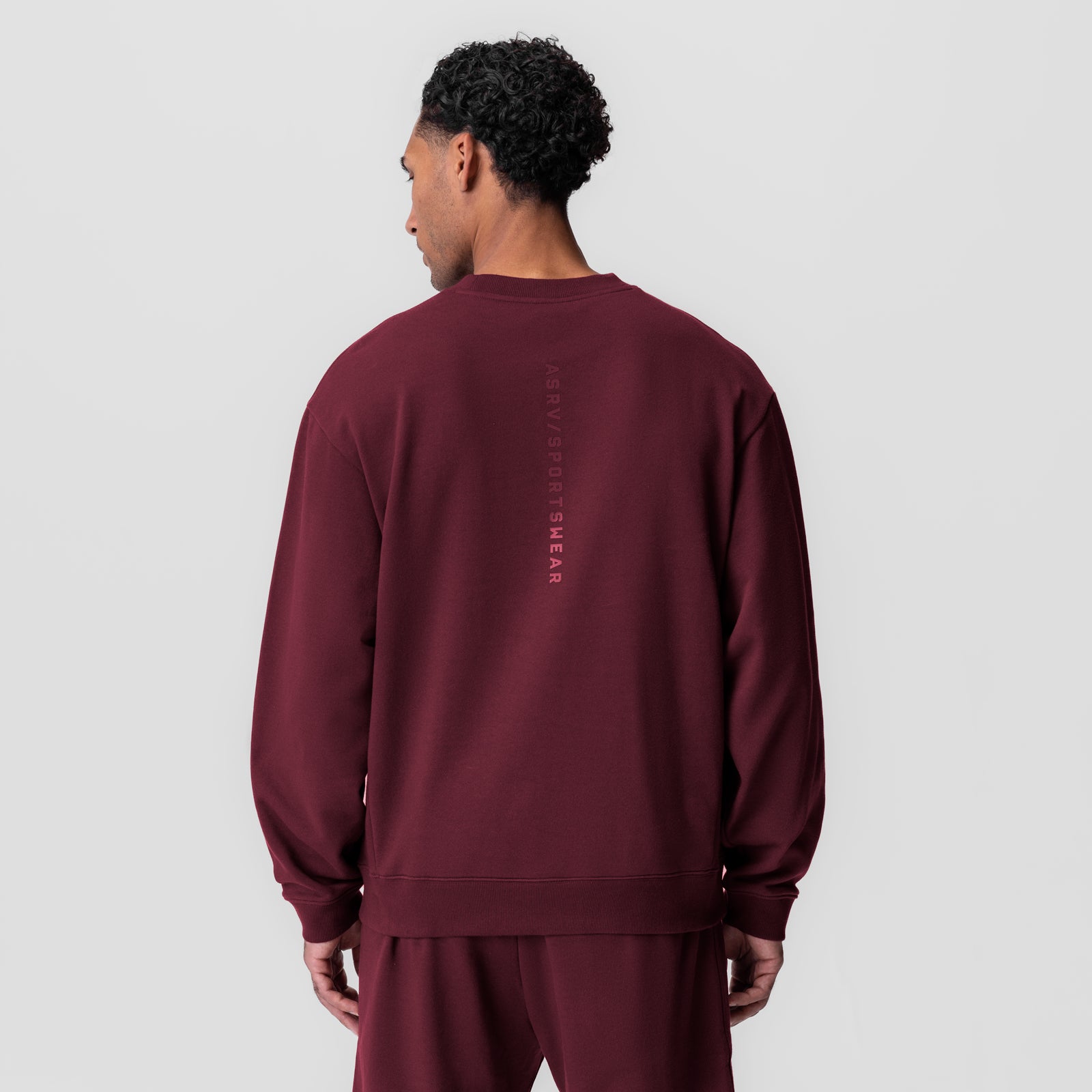 Herringbone Terry Crewneck in crimson, back view on model
