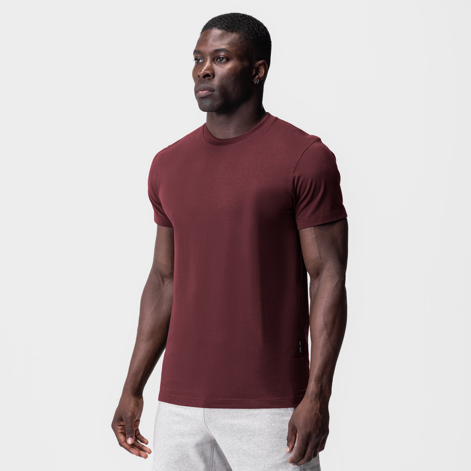 Supima Essential Tee in crimson worn by male model, front view
