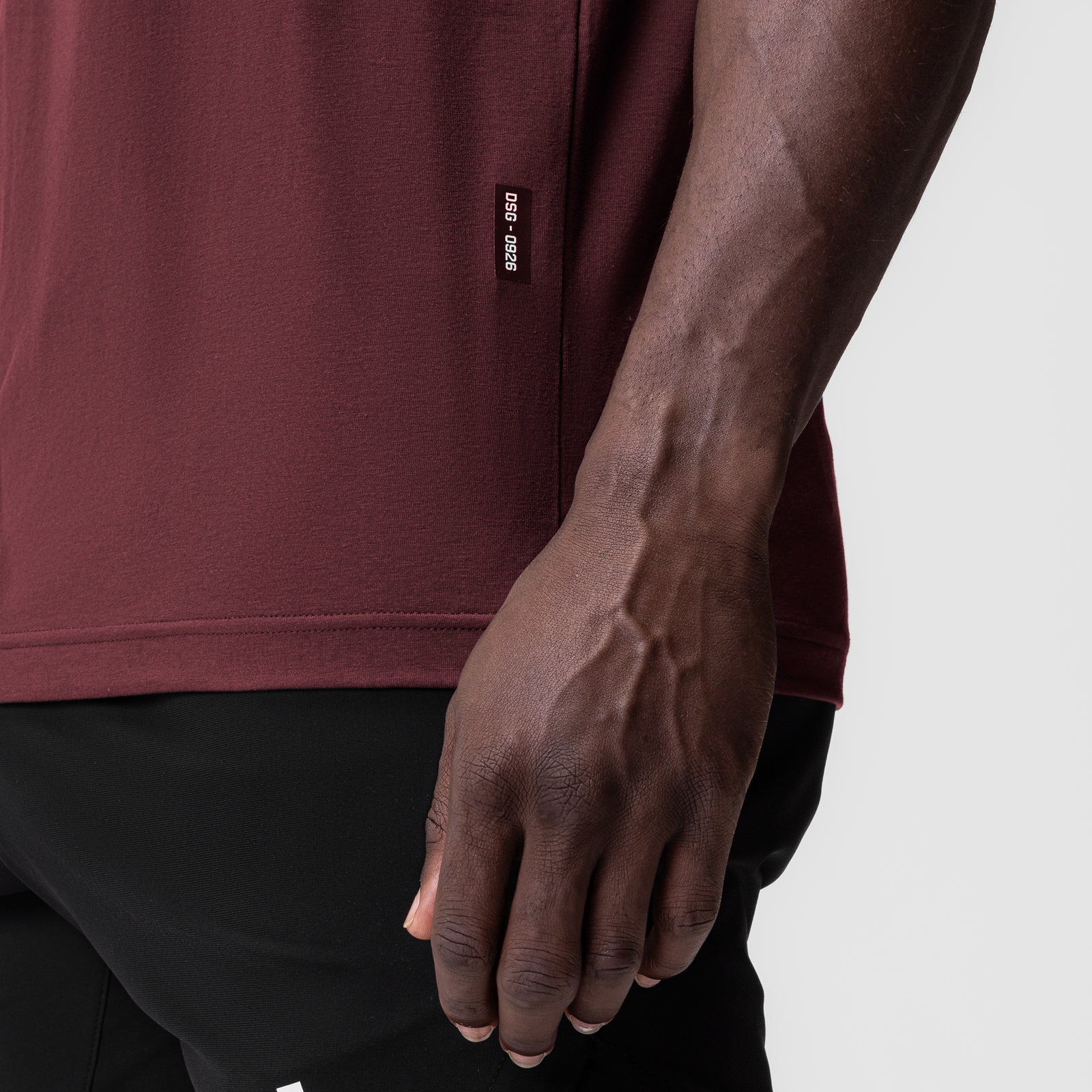 Crimson Supima® Muscle Tank worn by model, side view showing fit and fabric detail