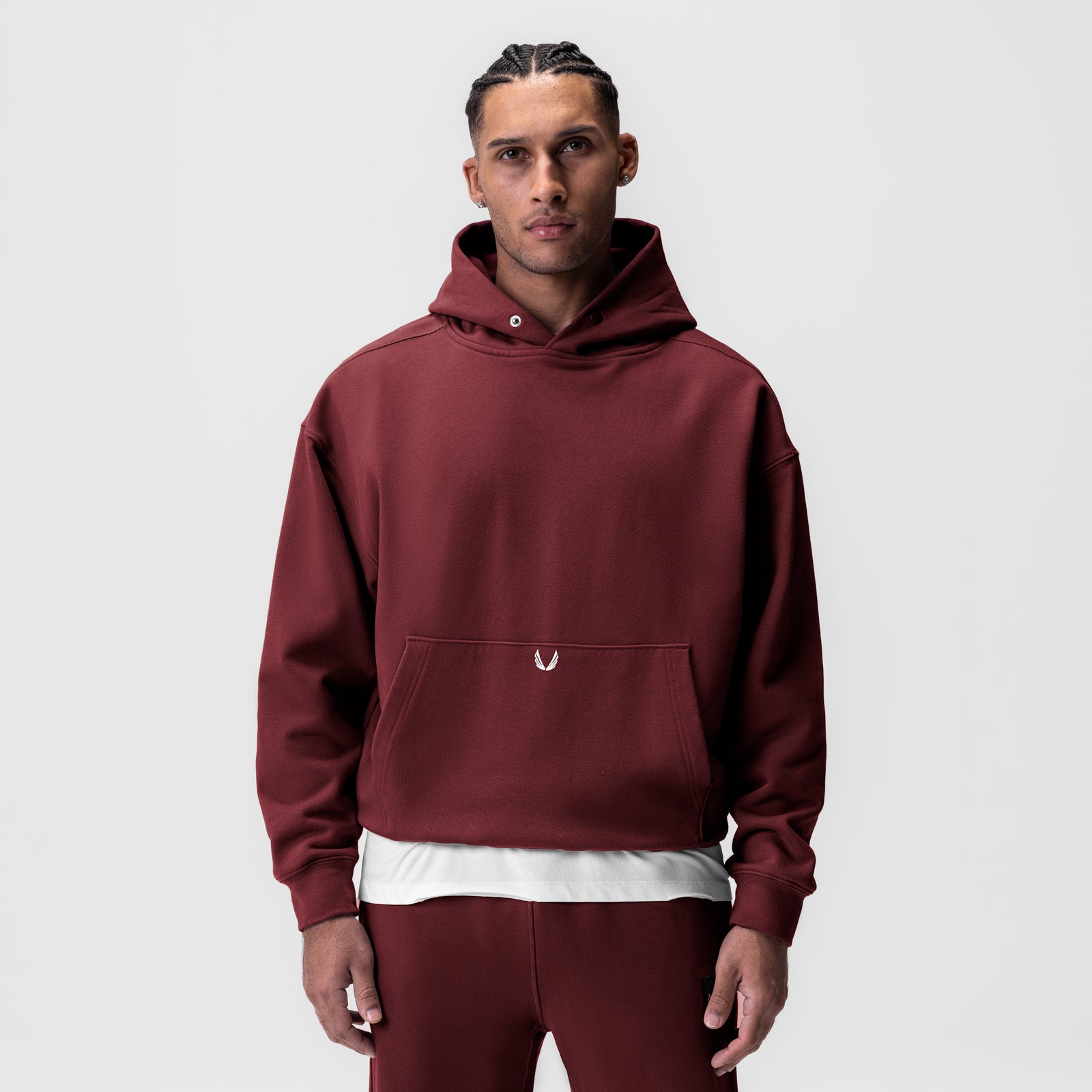 Tech-Terry Hoodie in crimson worn by male model, front view