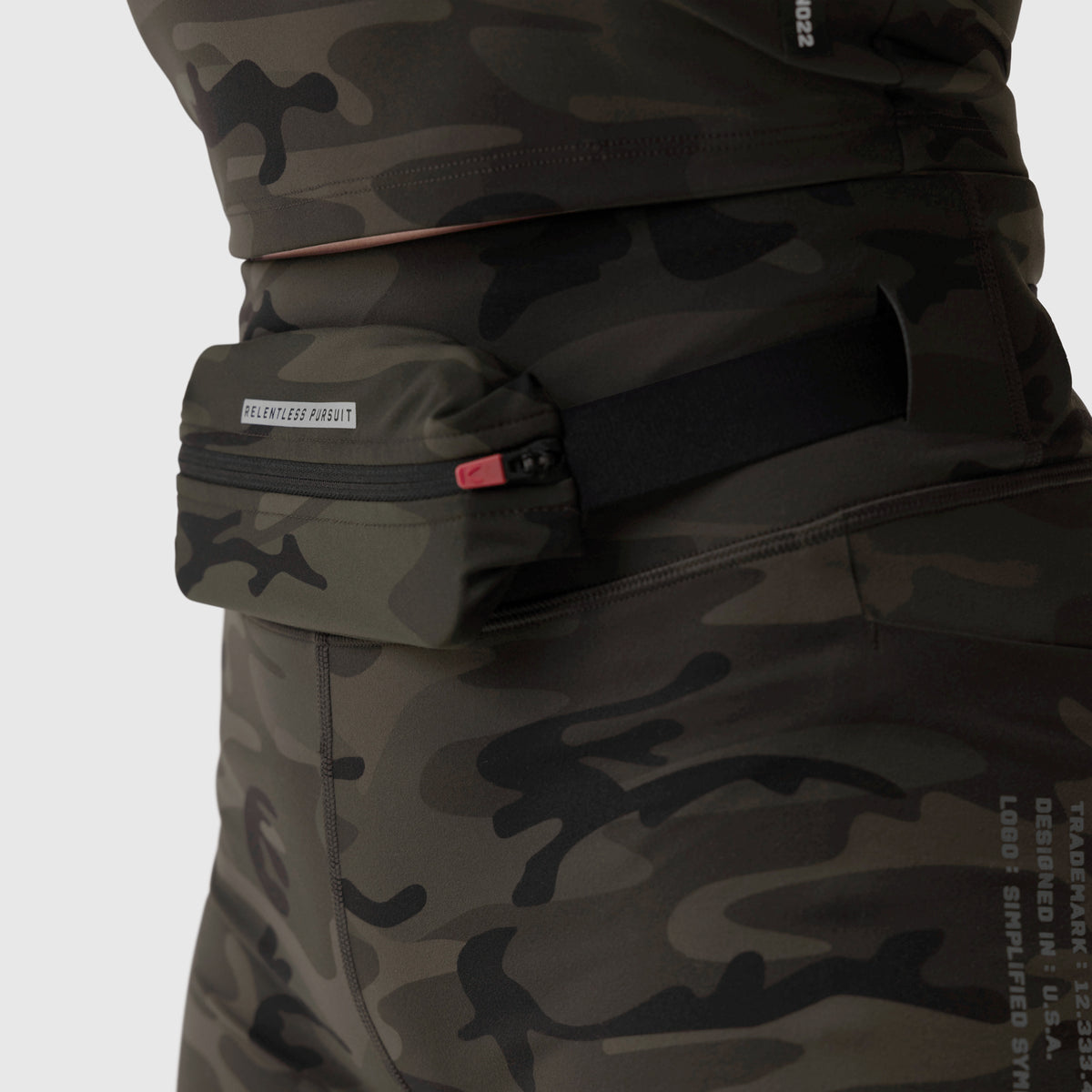 LYCRA® 3-in-1 Biker Short in Dark Camo worn with matching jacket, waist detail
