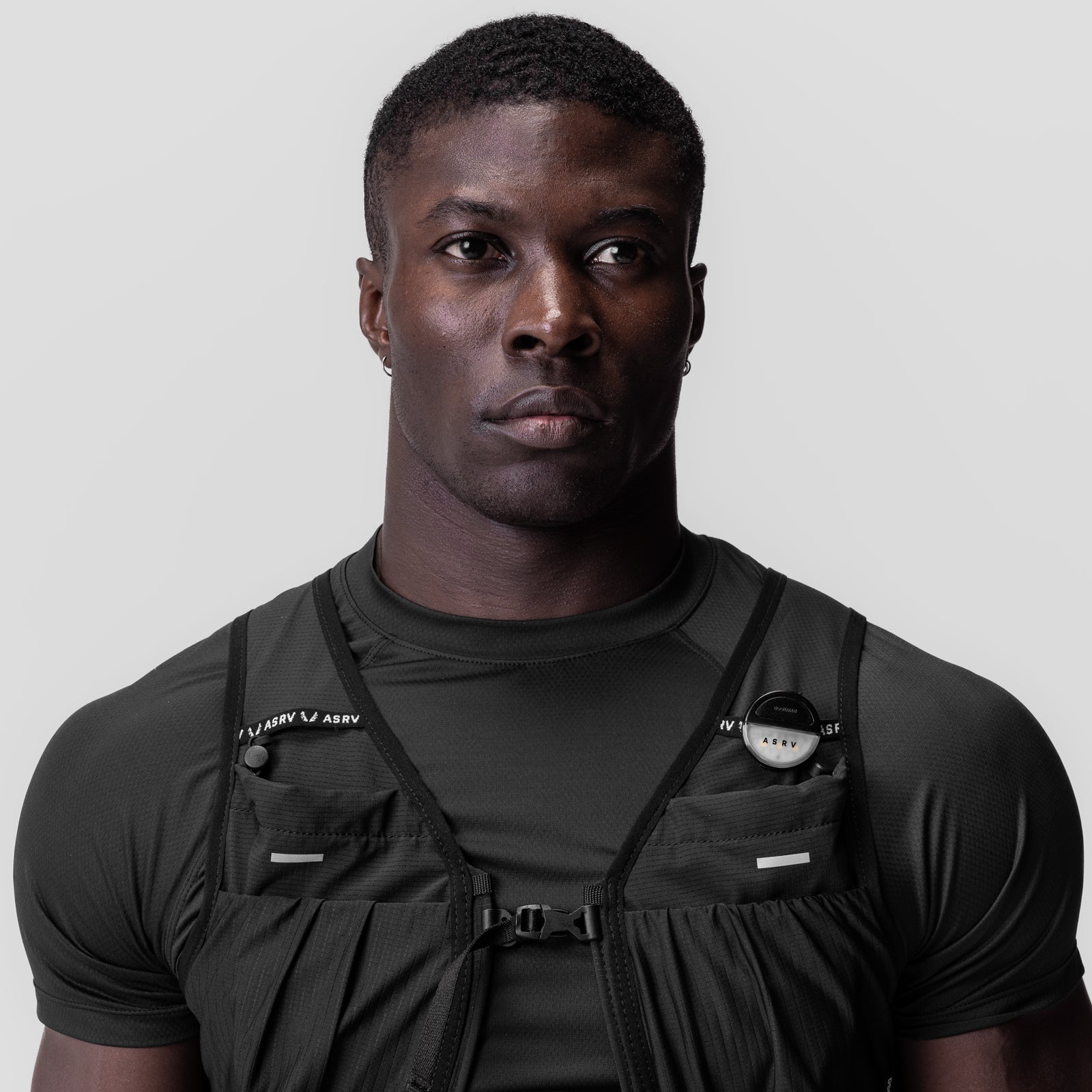 Black ASRV Eclipse tactical vest worn over black t-shirt, front view on model