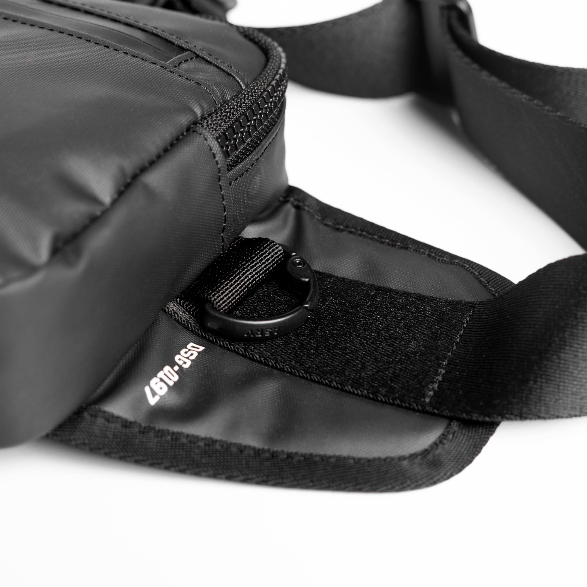 Flatlay water resistant small crossbody bag in black, detail view