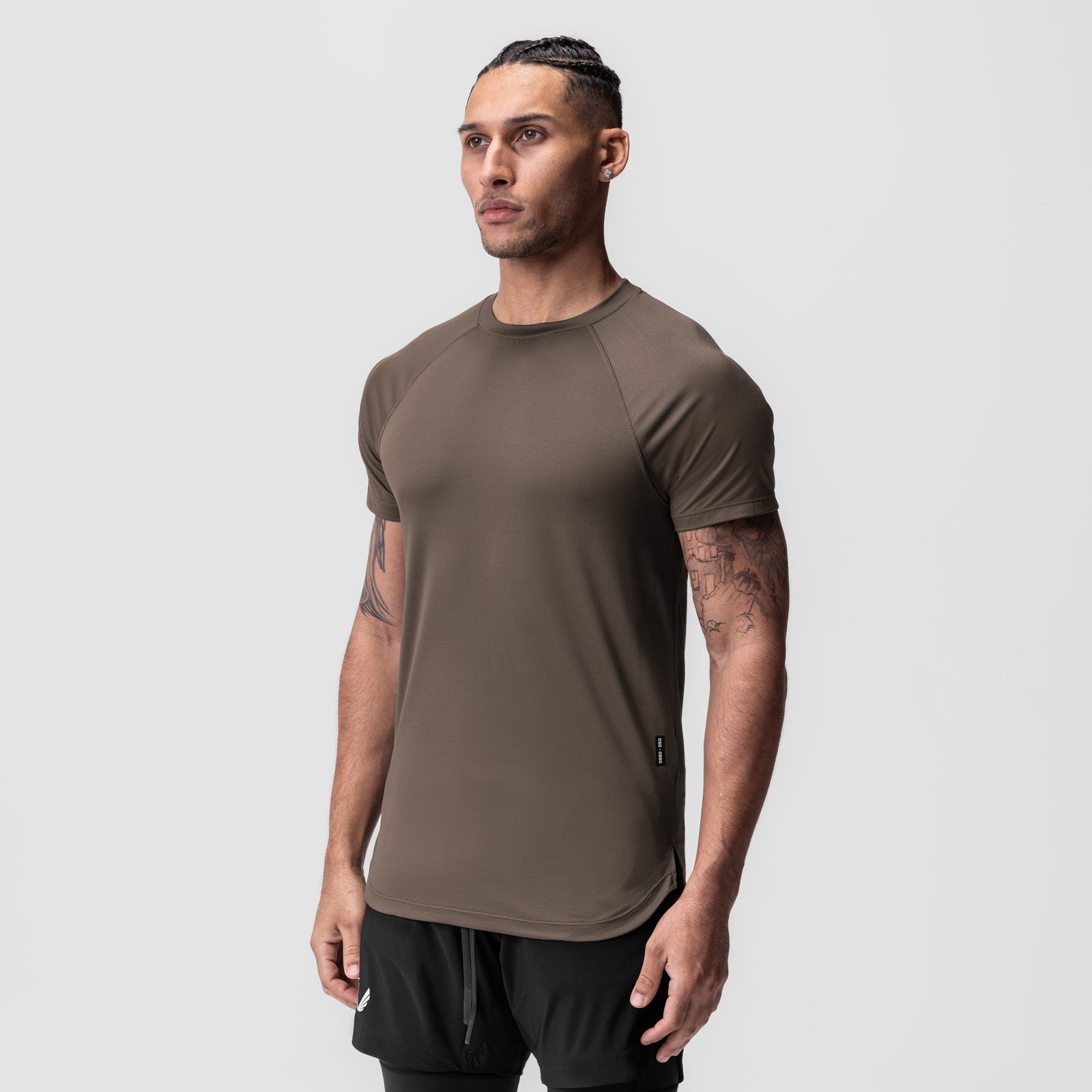 AeroSilver Established Tee in deep taupe, worn by model in three-quarter view