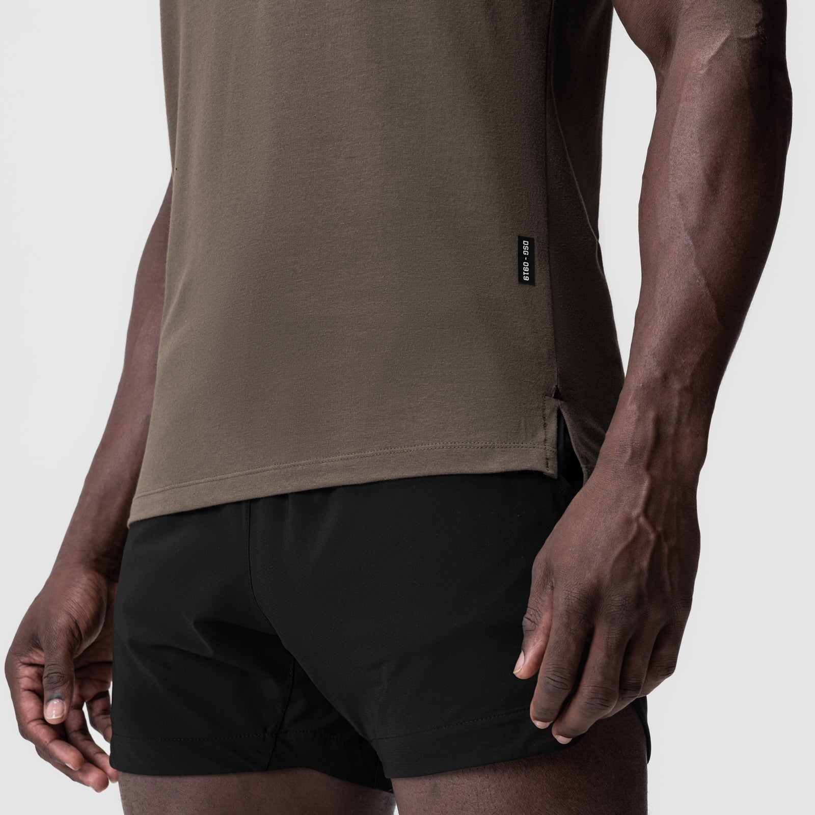 Supima® Fitted Tee in deep taupe worn with black shorts, side view