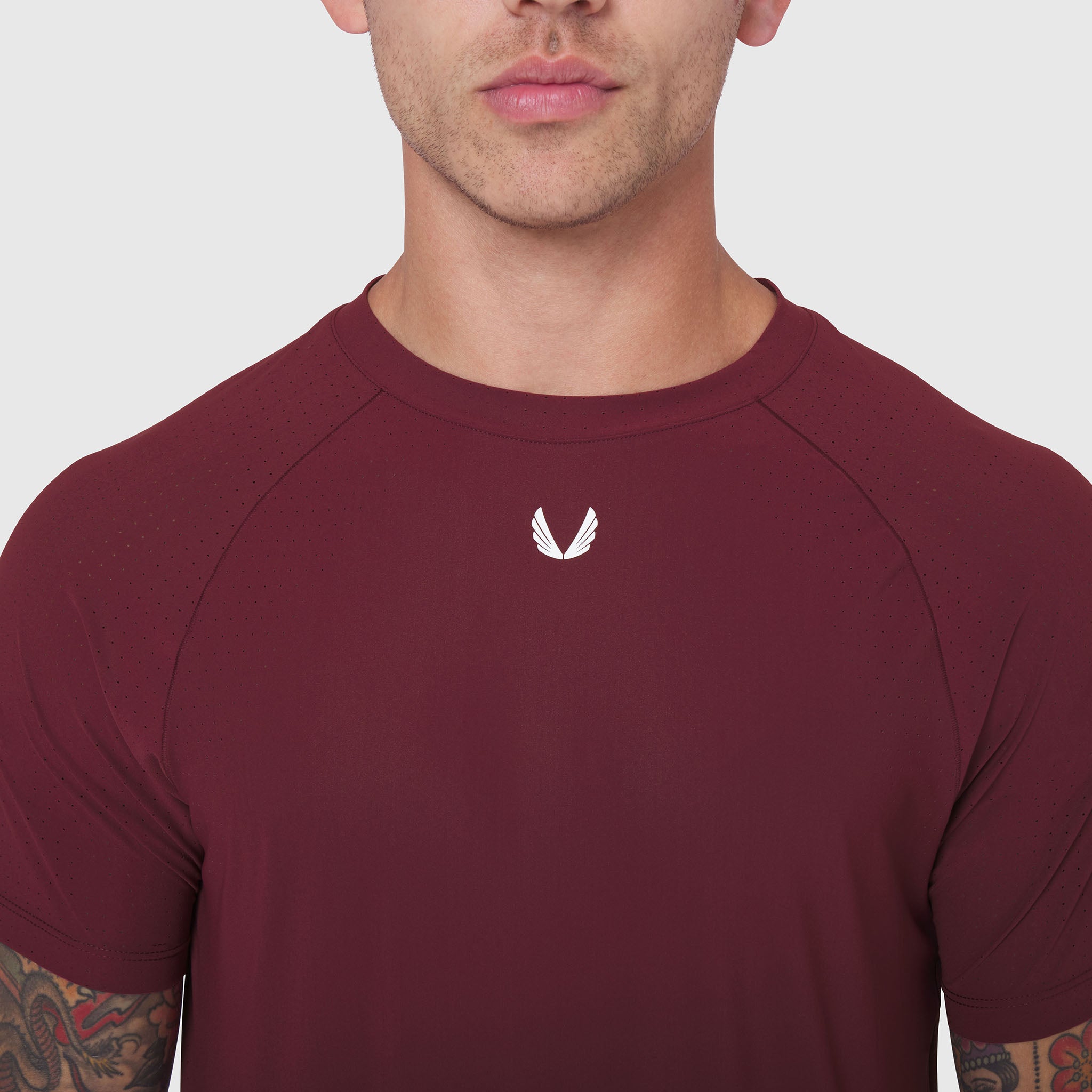 Laser-Vent Established Tee in crimson worn by male model, front view