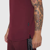 Laser-Vent Established Tee in Crimson worn by model showing side view with tattoos visible