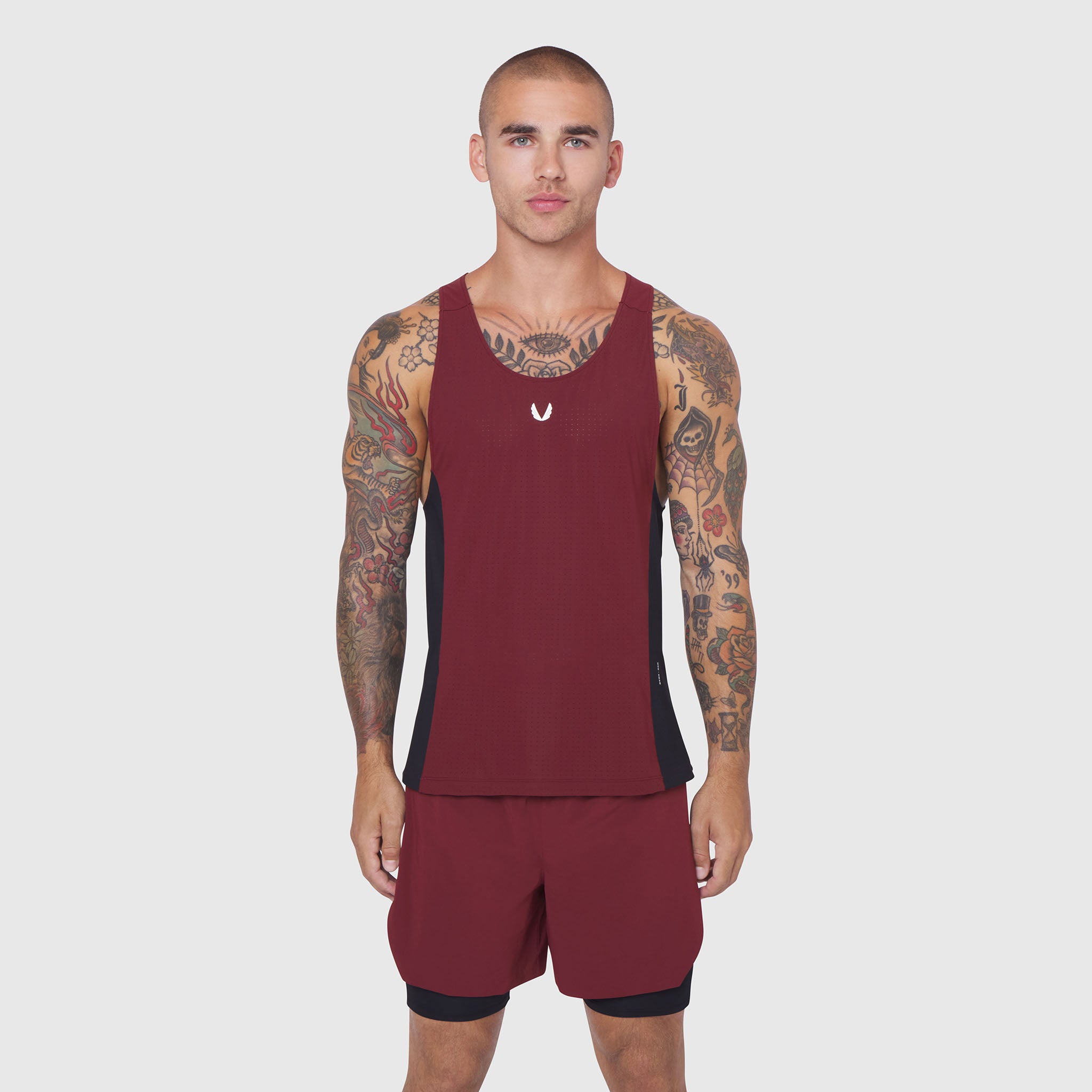Laser-Vent™ Singlet Tank in Crimson/Black worn by male model, front view