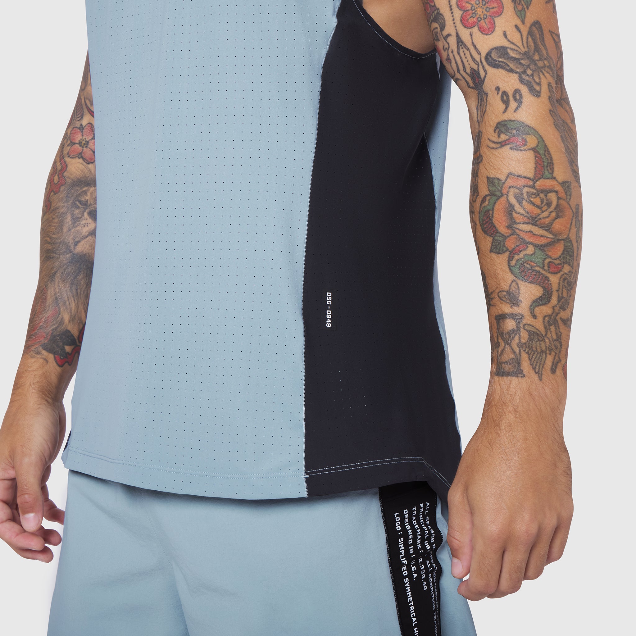 Laser-Vent Singlet Tank in Light Sky/Black worn by tattooed model, front view