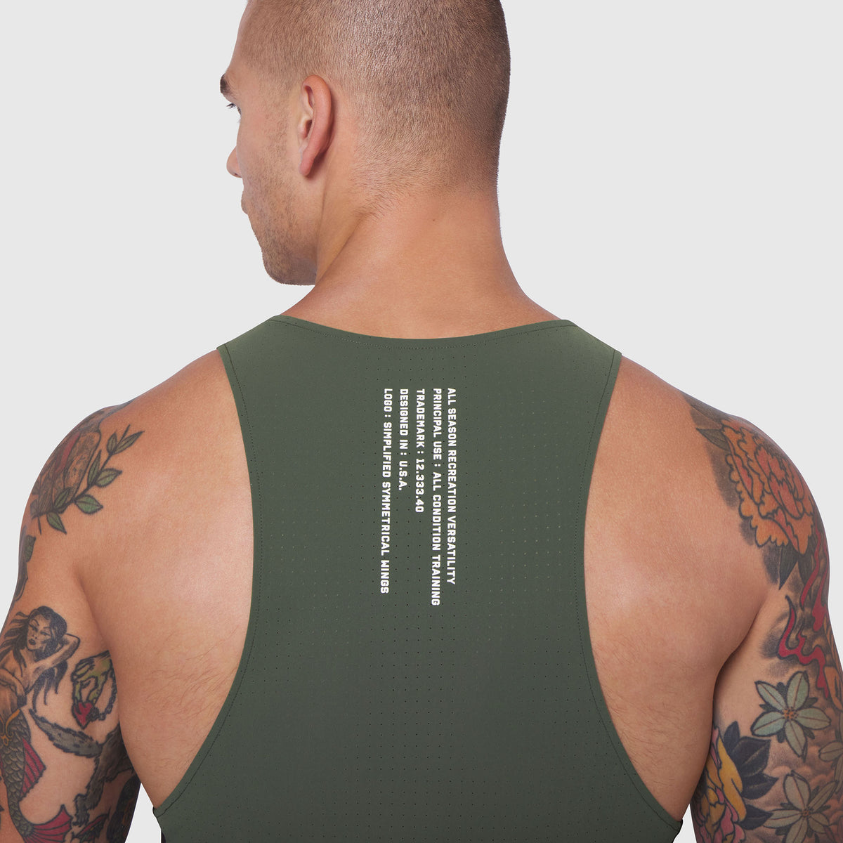 Laser-Vent Singlet Tank in olive, back view on male model with tattoos