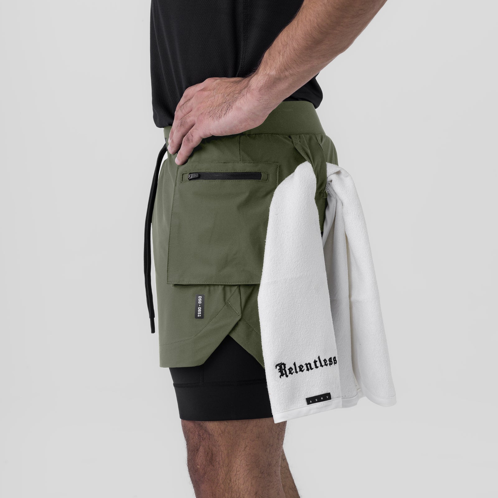 Tetra-Lite Cargo Short in olive worn by model, side view with white towel