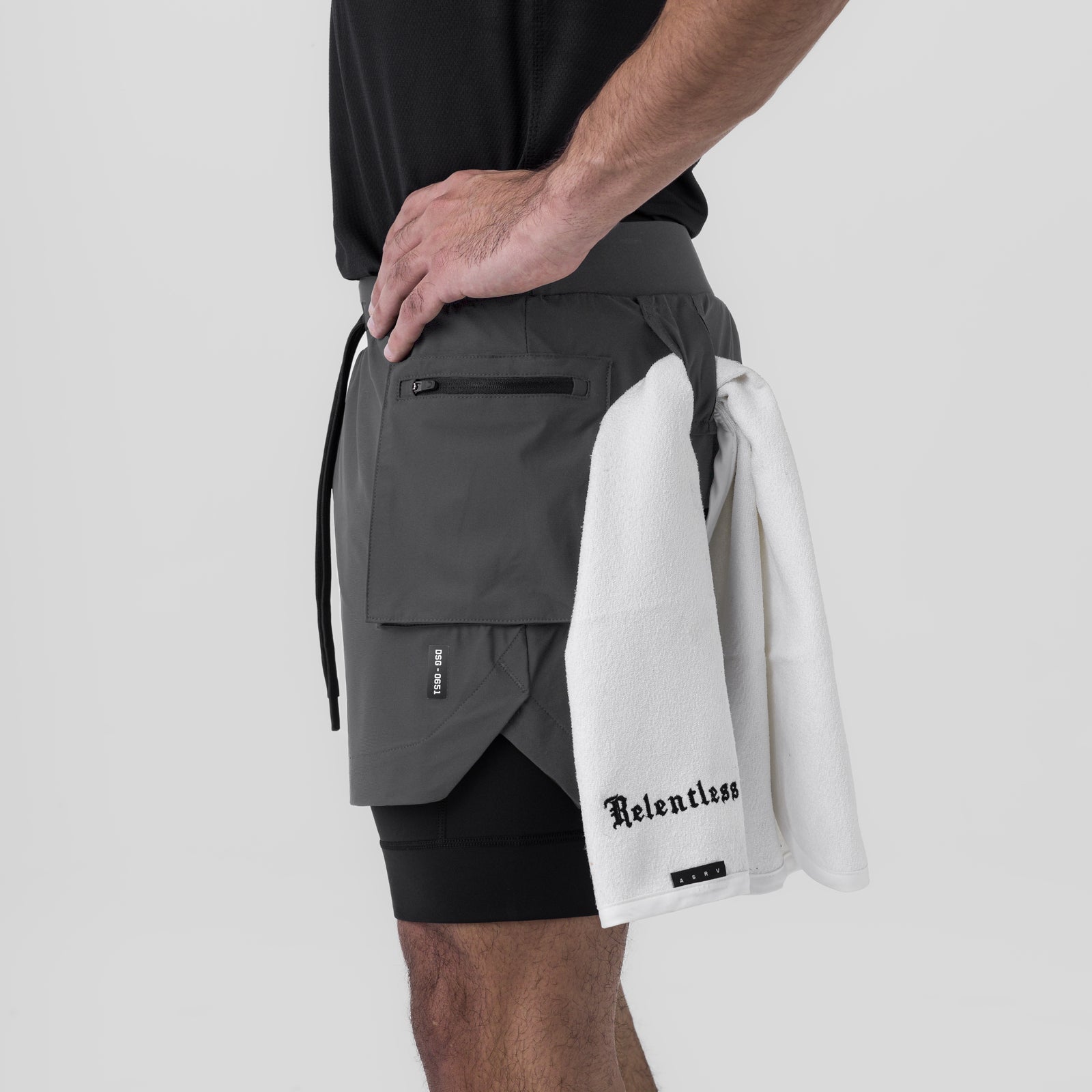 Tetra-Lite Cargo Short in Space Grey worn by model, side view with white towel