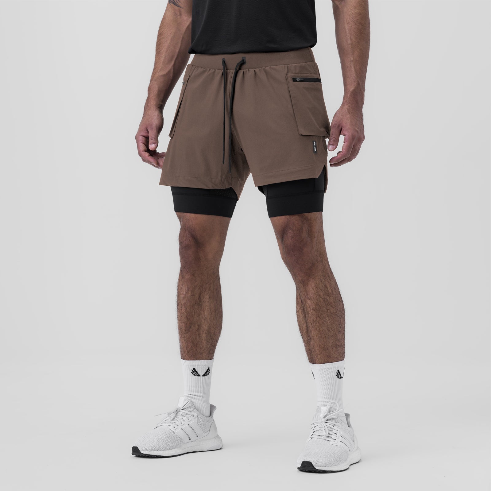 Tetra-Lite Liner Cargo Short in deep taupe worn with black compression shorts, front view