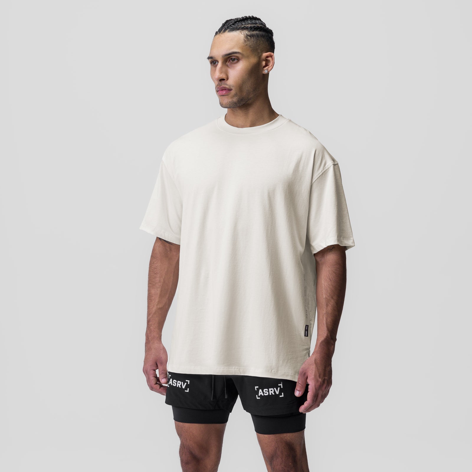 Ivory cream oversized Supima® tee worn with black shorts, front view on model