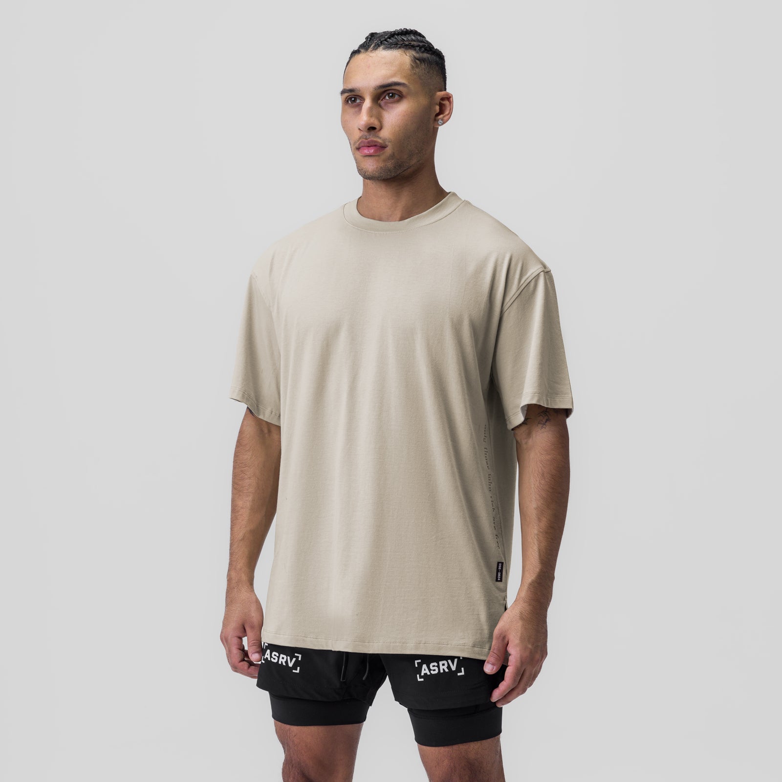 Supima® Oversized Tee in Sand Smoke worn with black shorts, front view