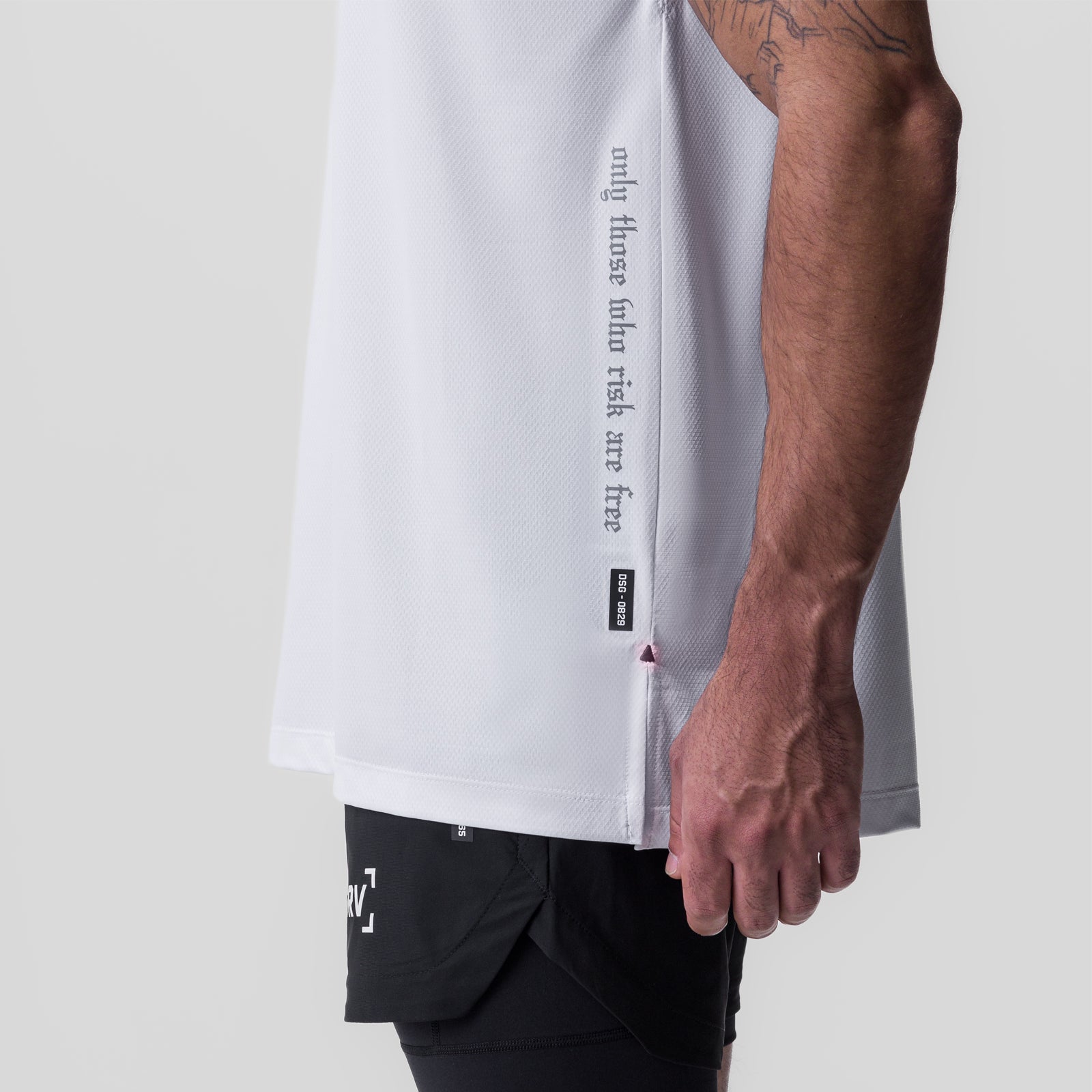 Silver-Lite™ 2.0 Oversized Cutoff tee in white, worn by model showing side view and sleeve detail