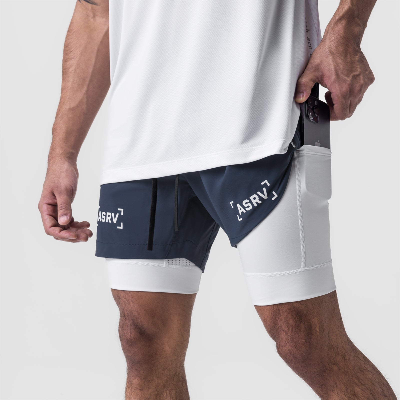 Tetra-Lite 5" Liner Short in Navy and White, worn by model showing side pocket detail
