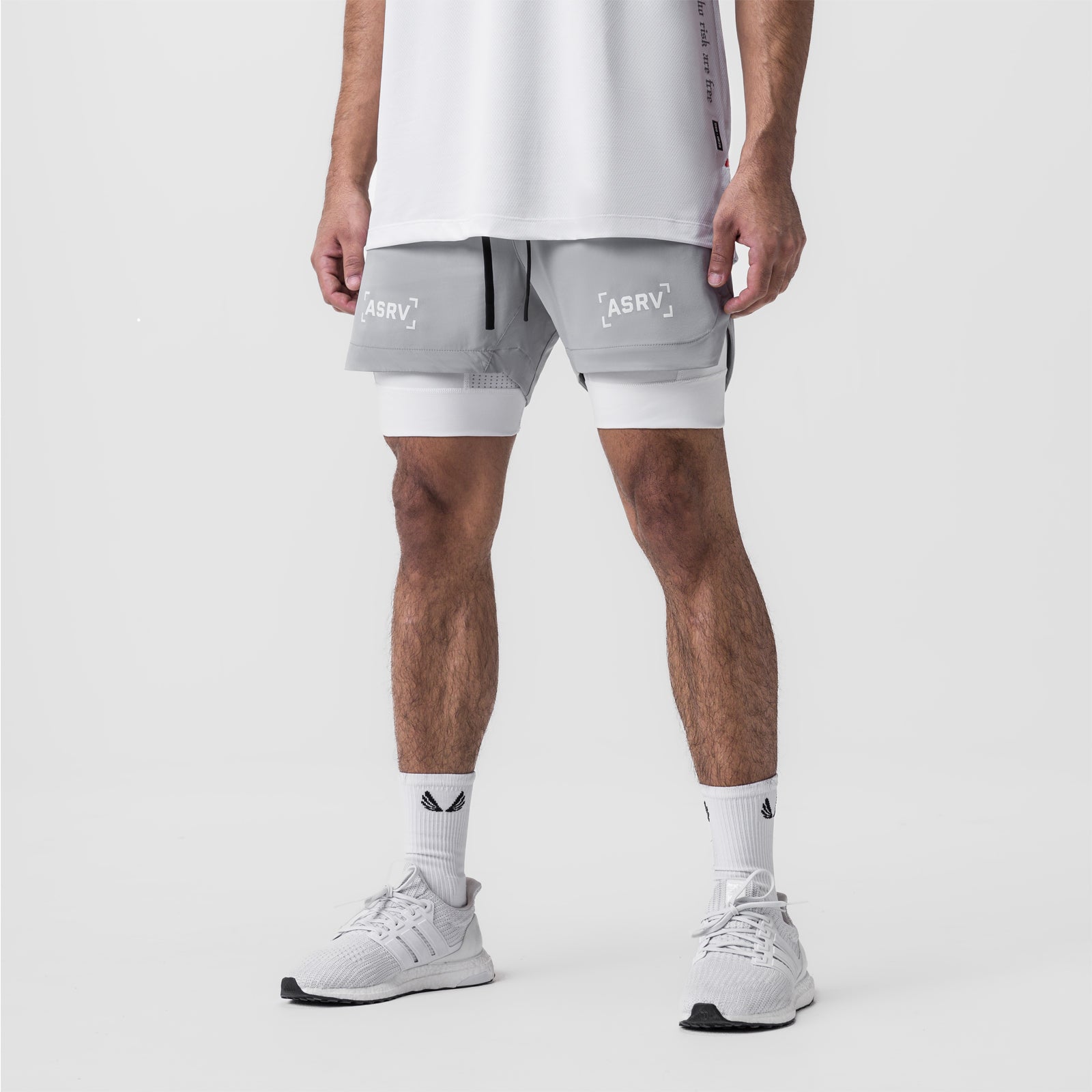 Tetra-Lite 5" Liner Short in slate grey and white, worn by model with white sneakers, front view