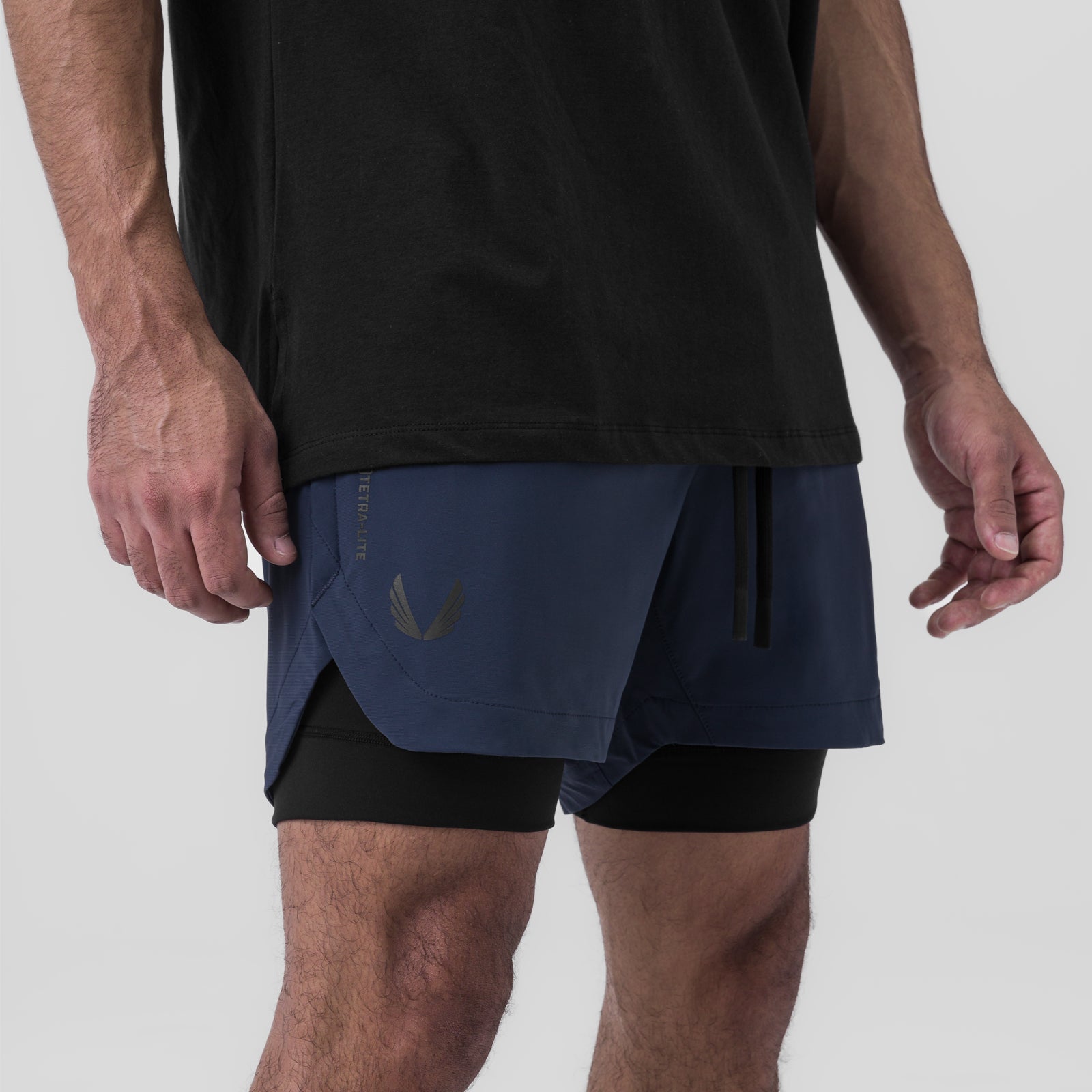 Tetra-Lite 5" Liner Short in Navy and Black, modeled from waist down