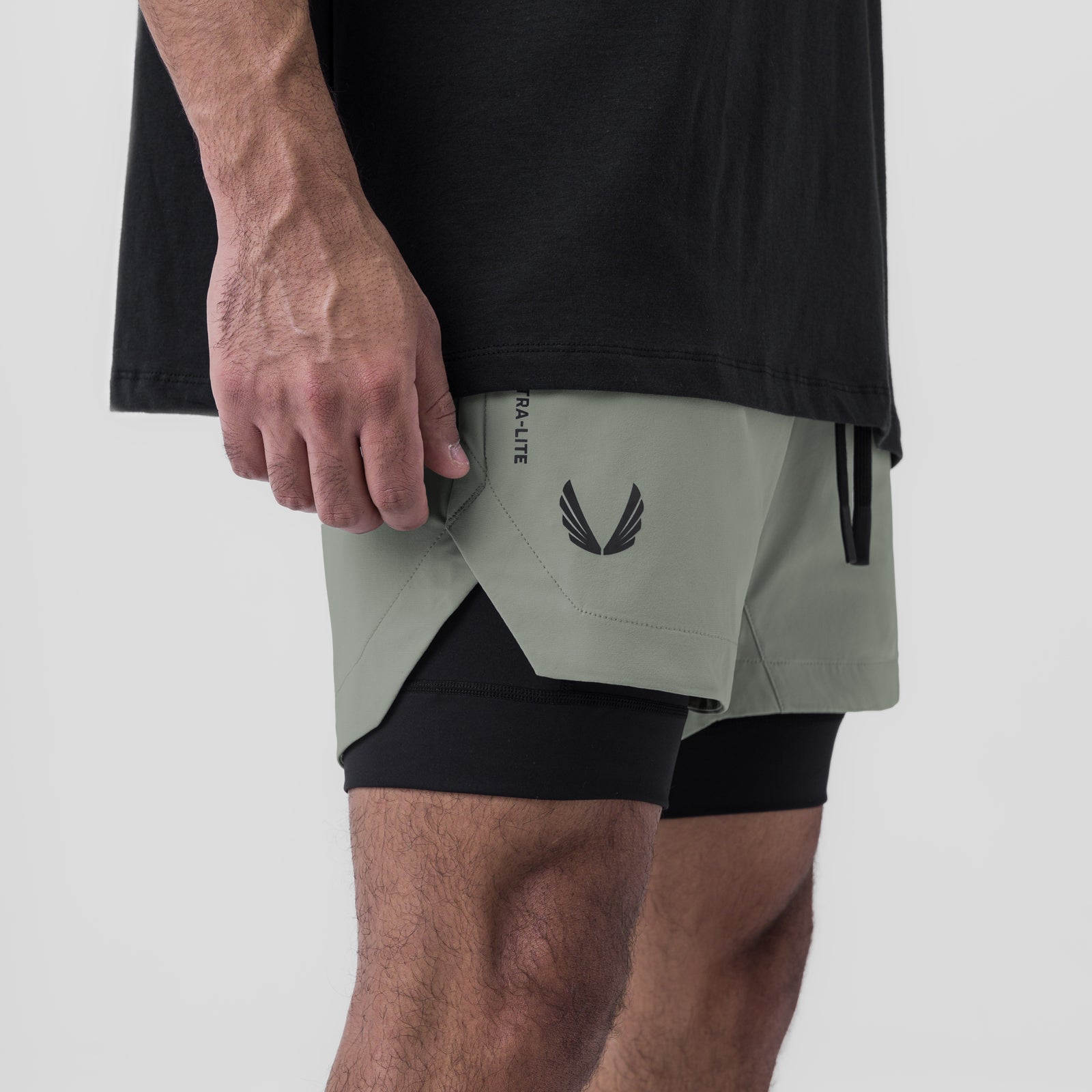 Tetra-Lite 5" Liner Short in Sage and Black, worn by model, side view