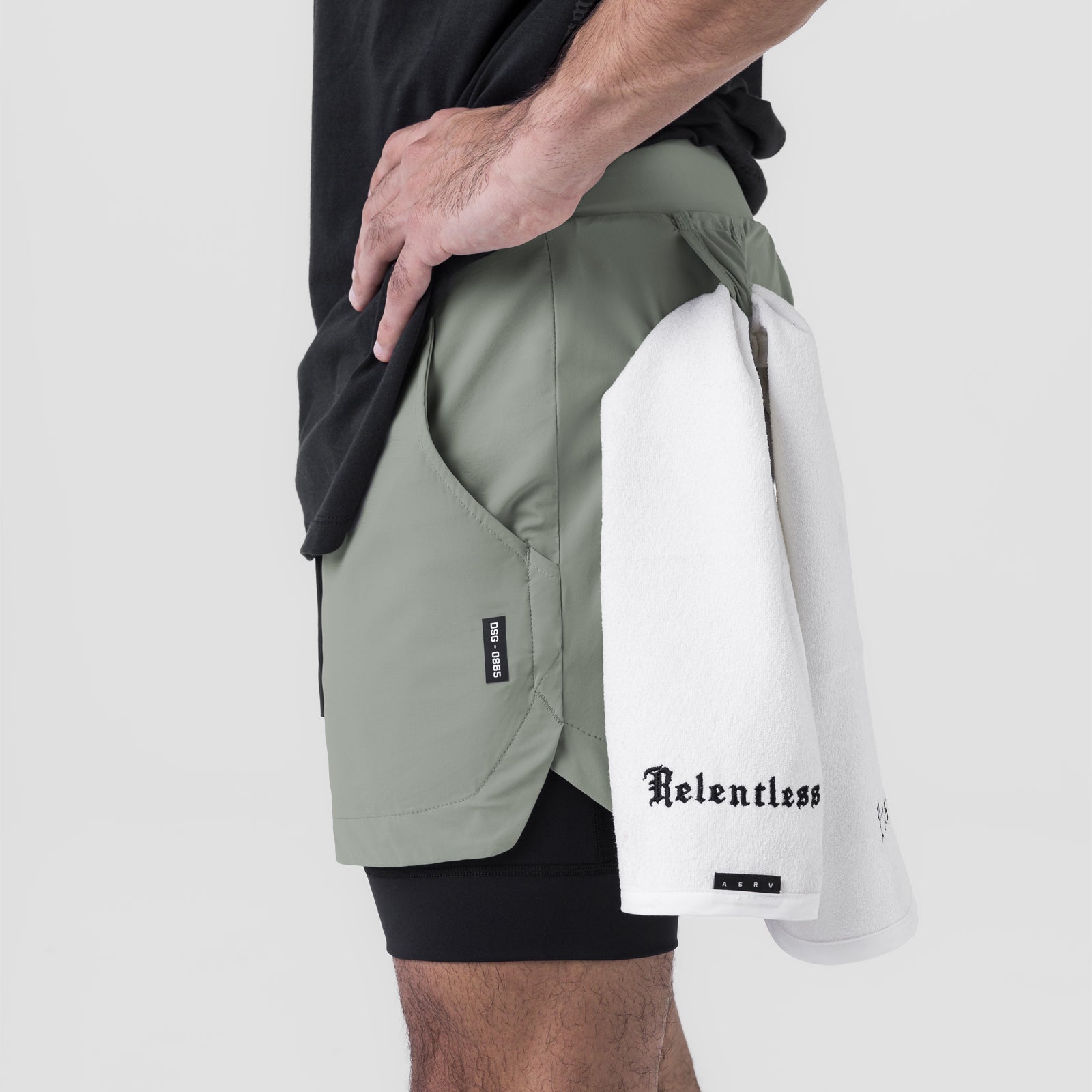 Tetra-Lite 5" Liner Short in sage and black, worn with white towel, side view