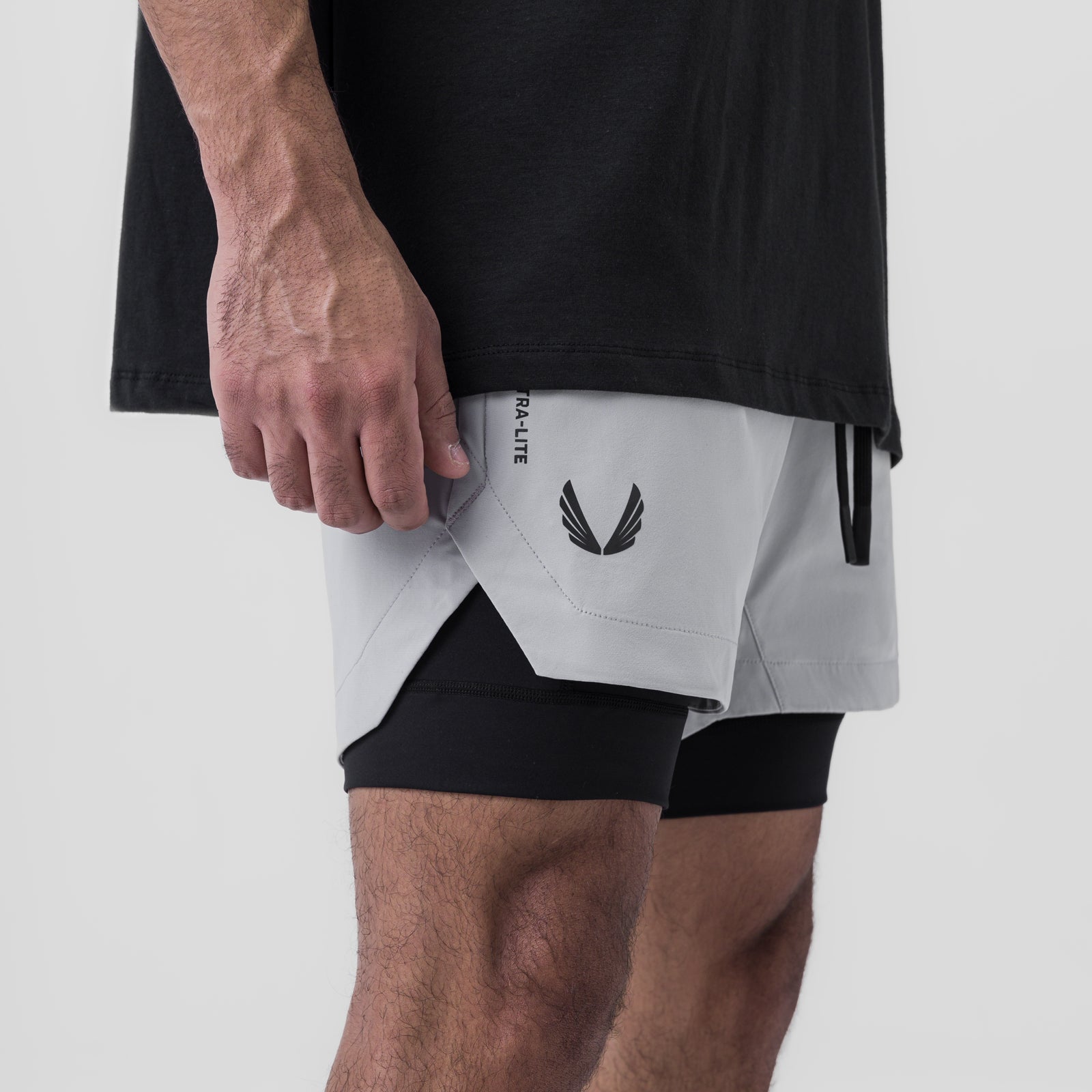 Tetra-Lite 5" Liner Short in slate grey and black, worn by model, side view